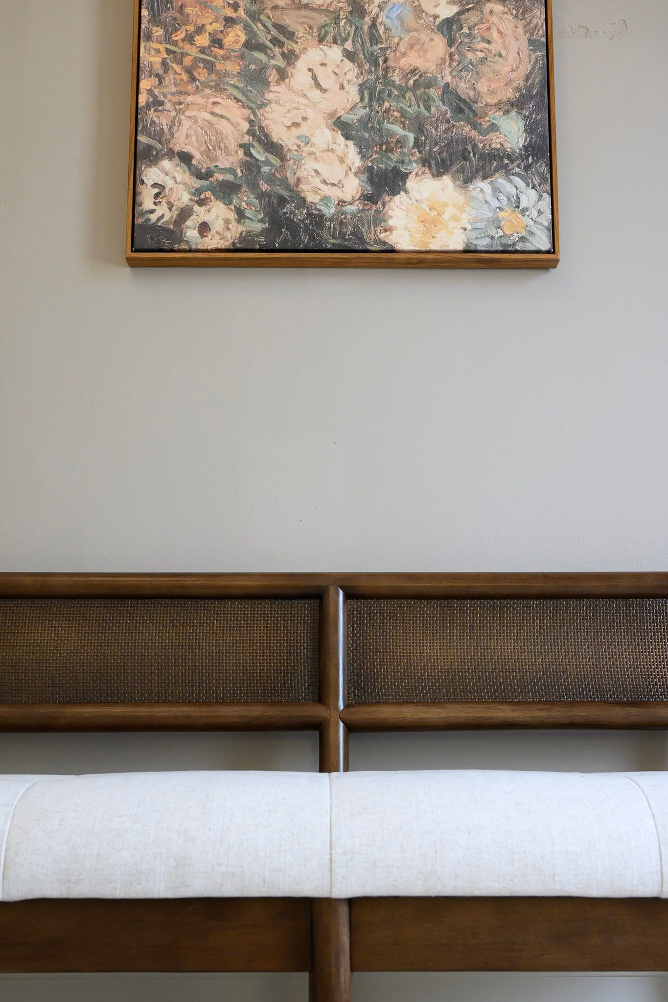 Modern brown and white upholstered headboard with clean lines and minimalist design against a neutral wall.