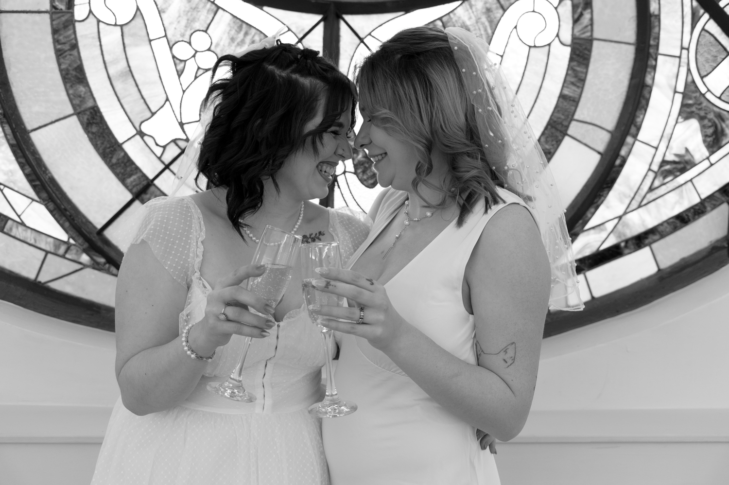 A sequence of black and white photos showing two people sharing intimate moments in front of a circular patterned wall.