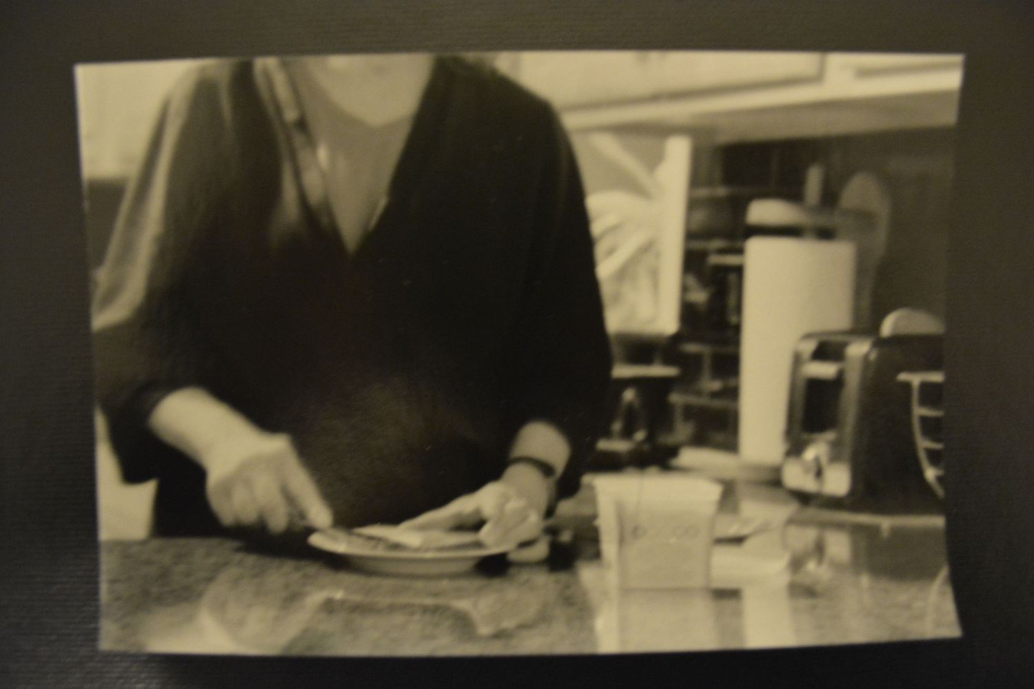 A series of vintage black and white photographs showing laboratory research work and equipment from the past.