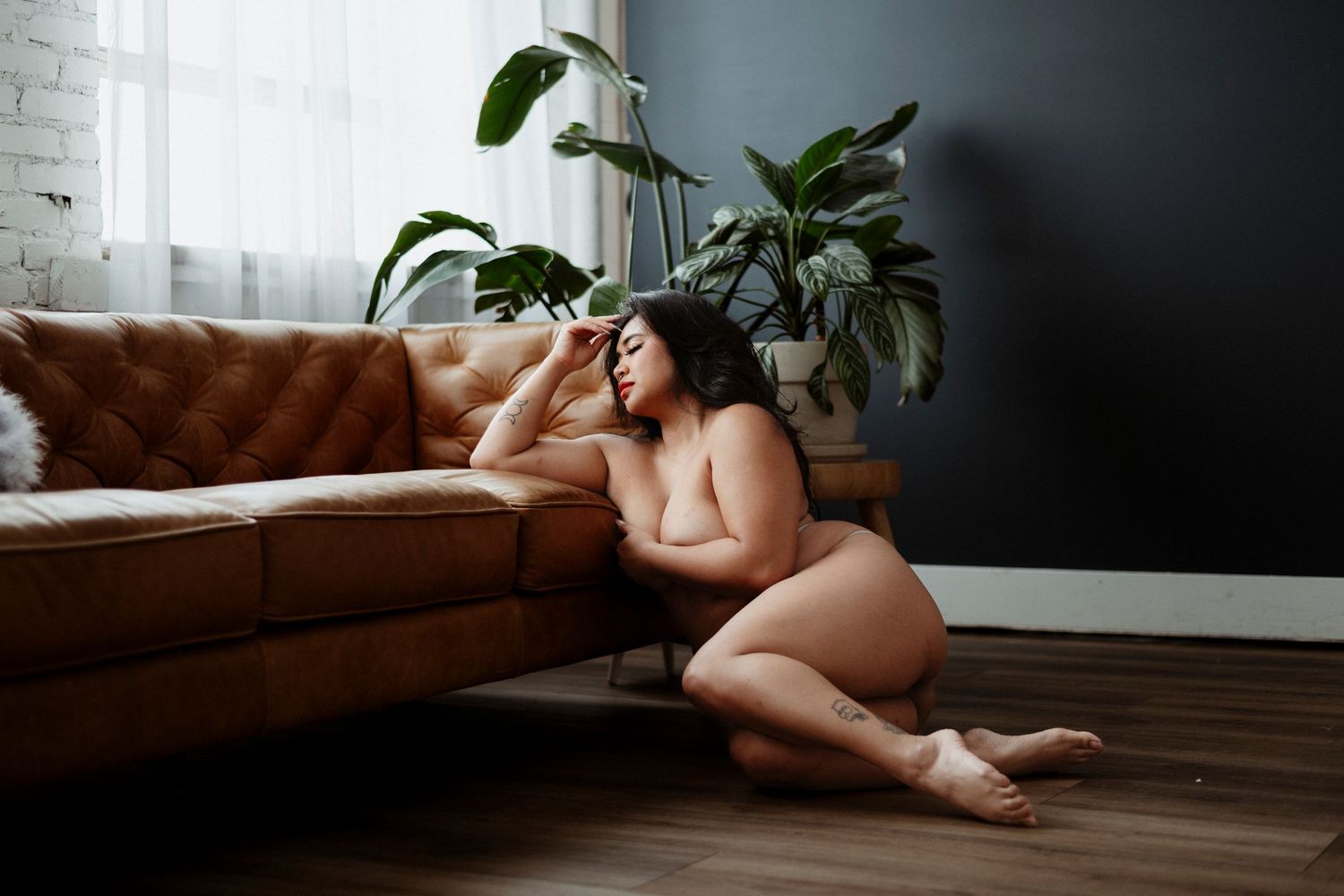 Artistic boudoir photo series showing silhouette against window light in moody interior setting.