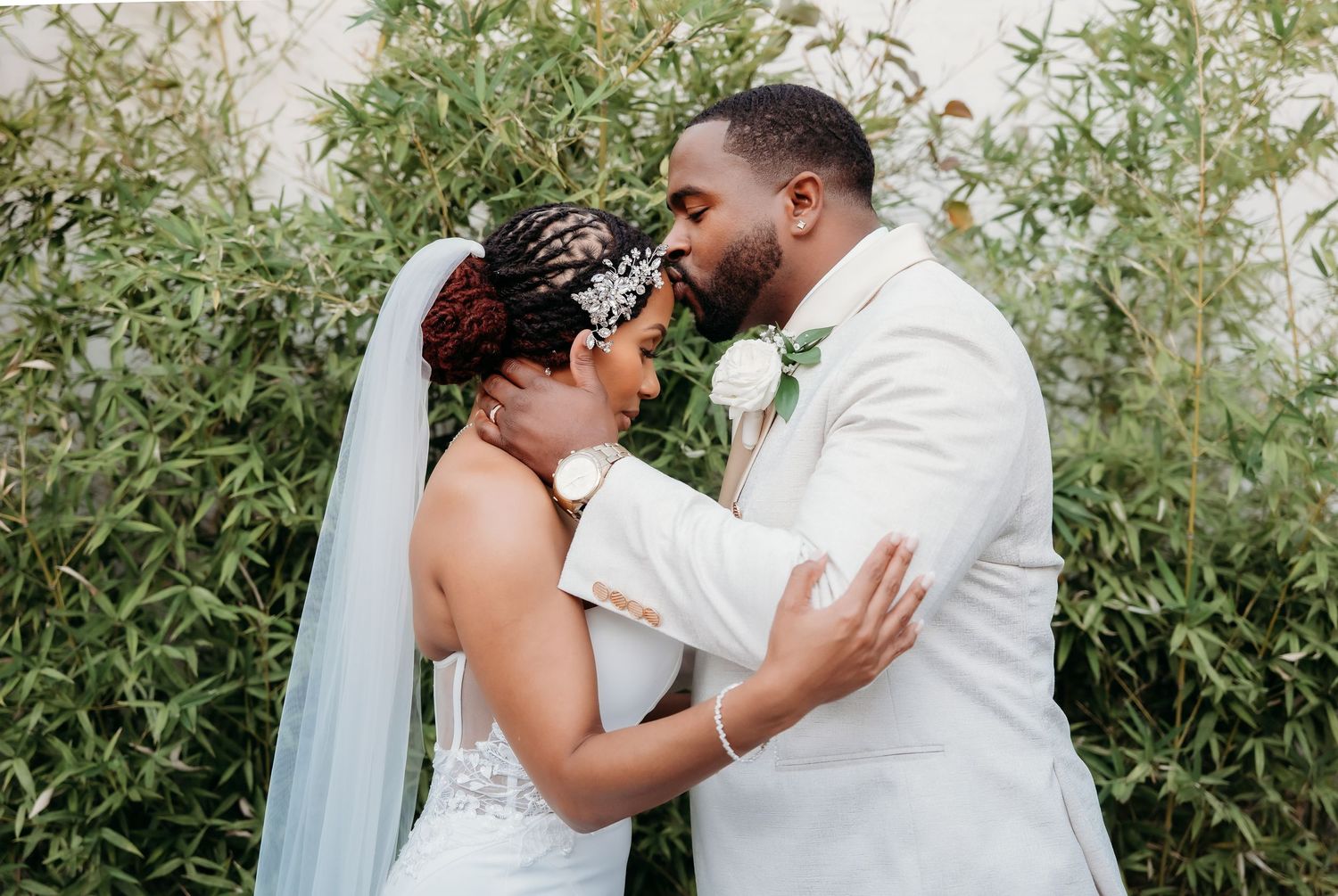 A romantic wedding photo session with a couple embracing outdoors.