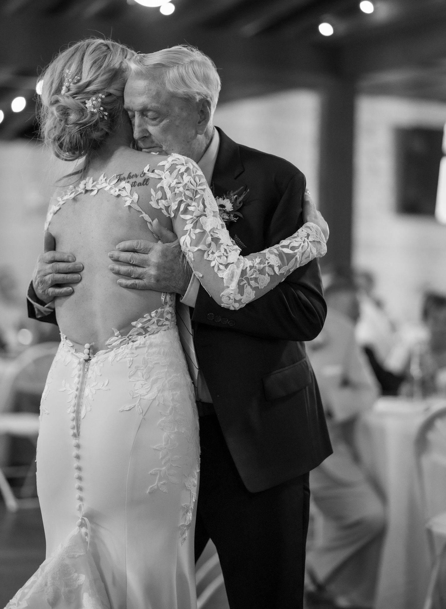 Intimate black and white dance photos showcase elegant lace wedding dress details.