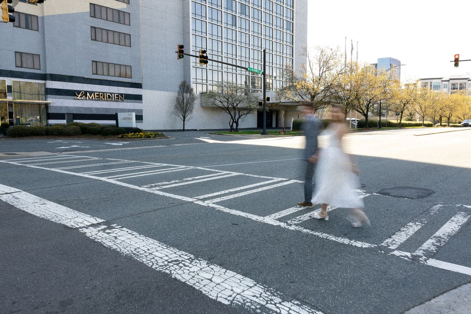 Series of street crosswalk photos showing white painted lines on asphalt with urban buildings in background.
