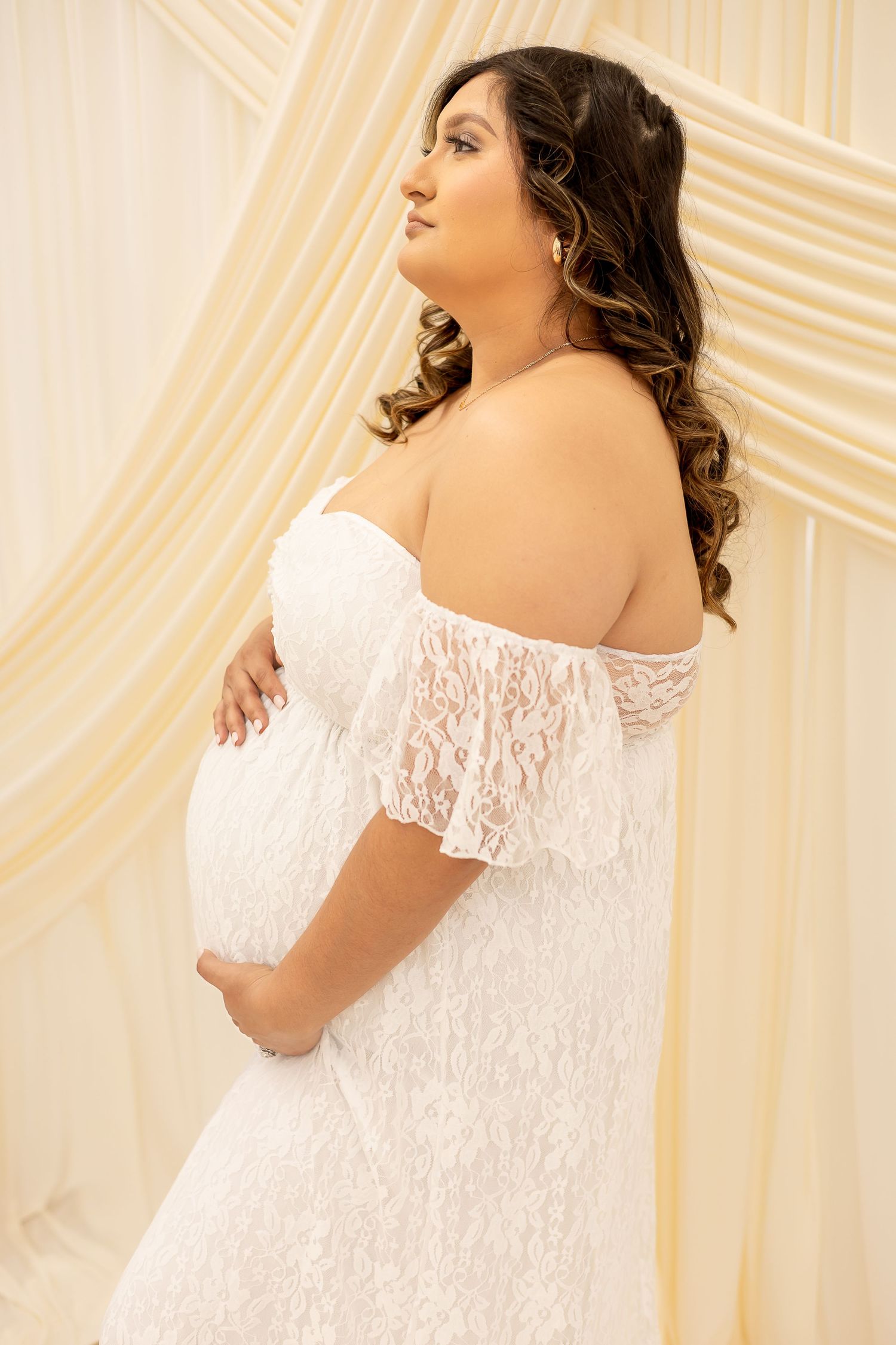 Elegant off-shoulder white lace wedding dress shown in multiple angles against a cream backdrop.