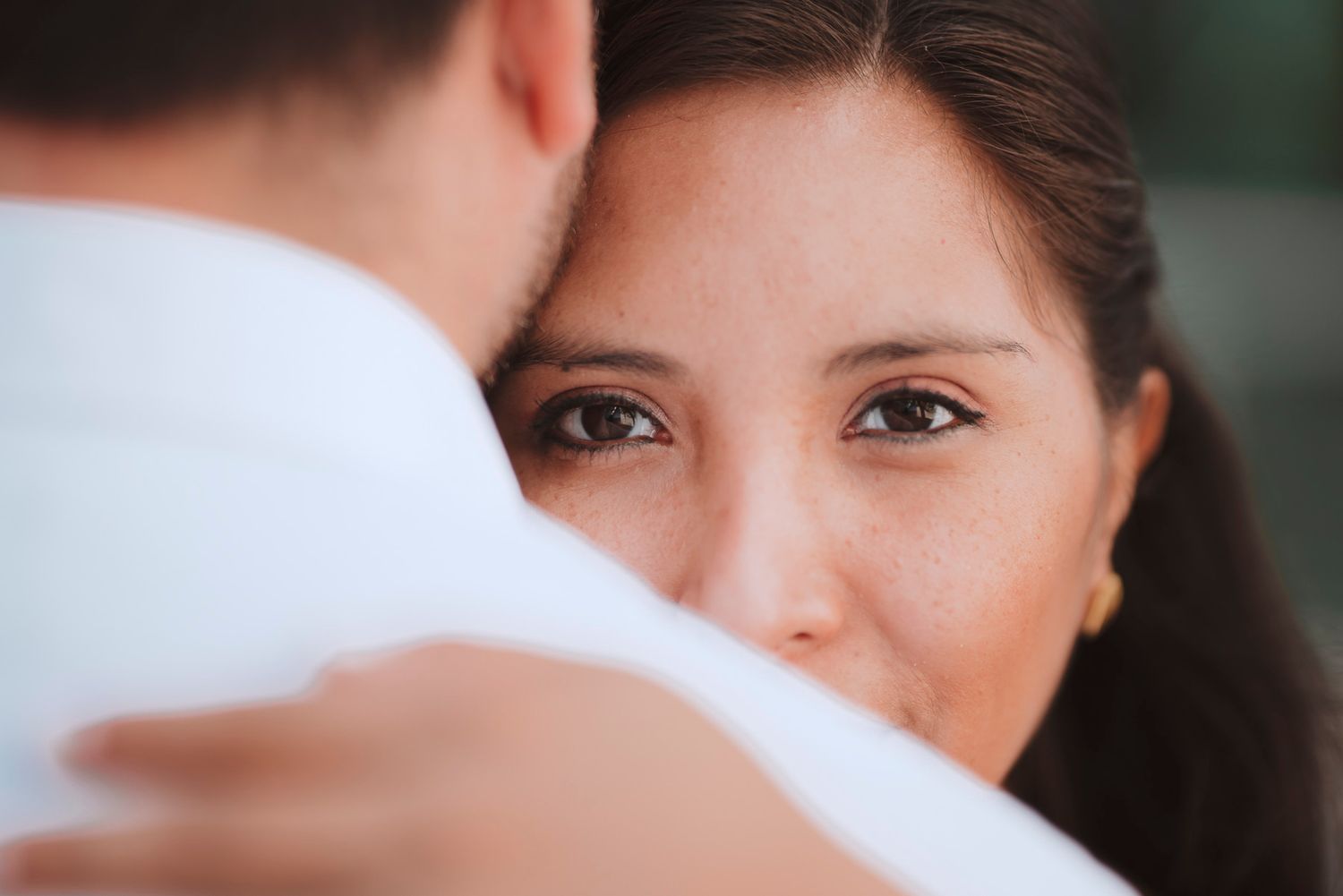 An intimate close-up moment between newlyweds during their wedding celebration.
