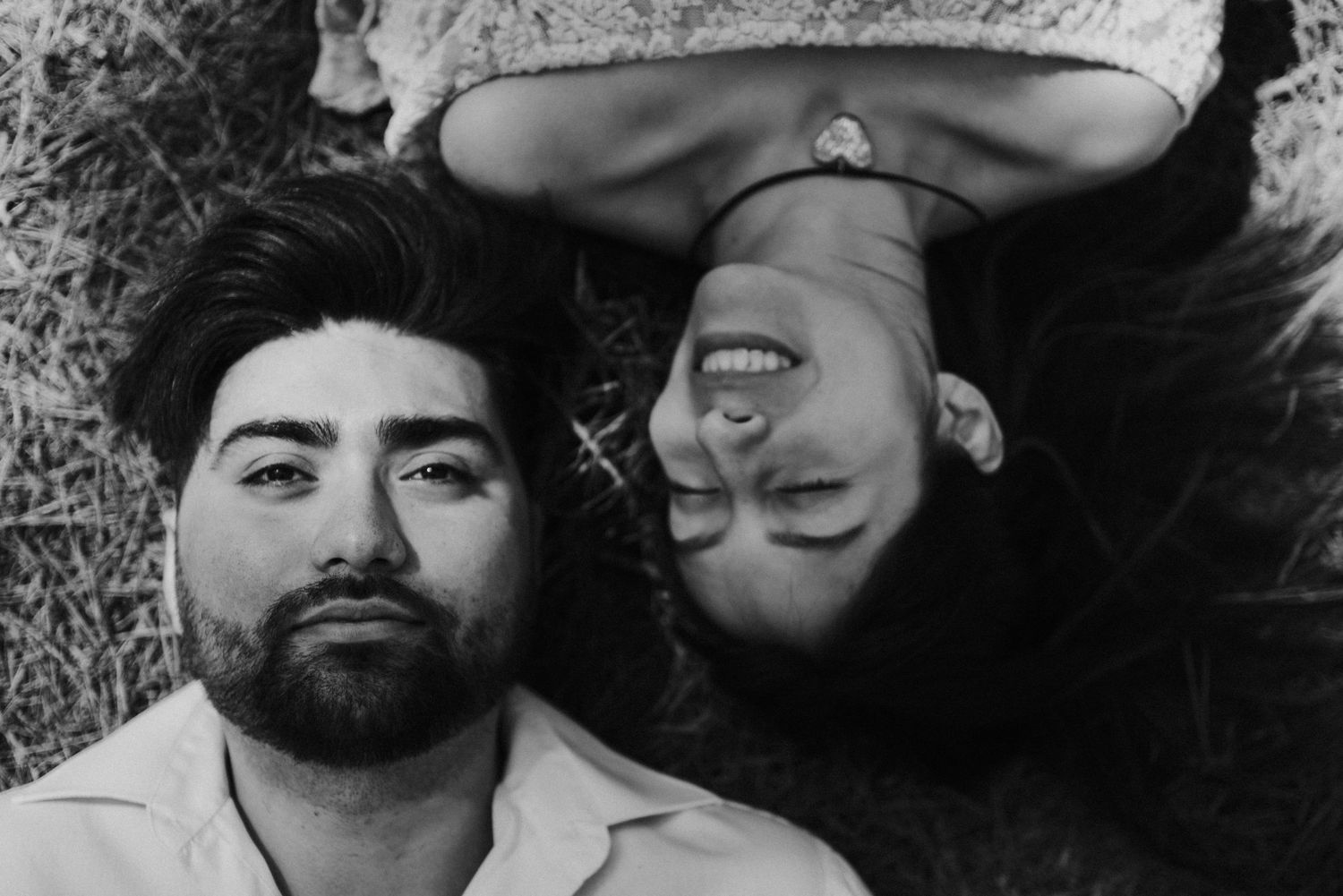 Black and white artistic portrait shot capturing intimate moment.