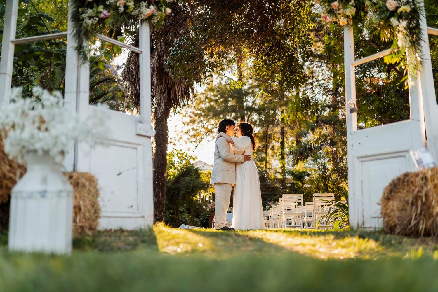 White rustic church doors create an elegant wedding ceremony backdrop.