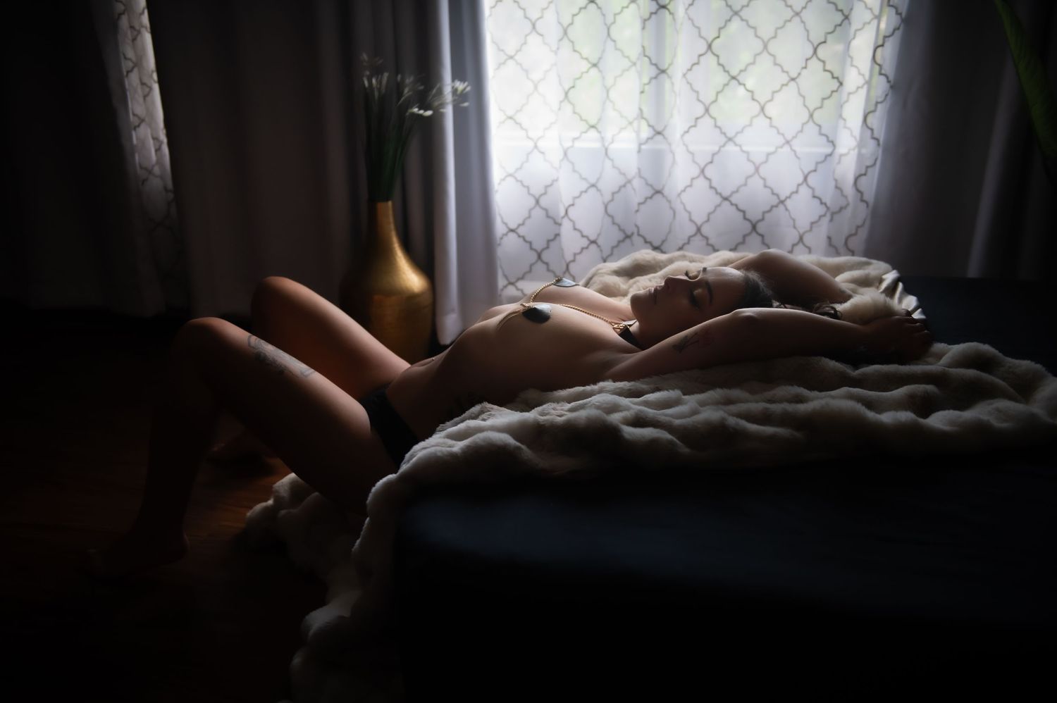 A sequence of dark and moody images showing someone sleeping peacefully in bed near a window.