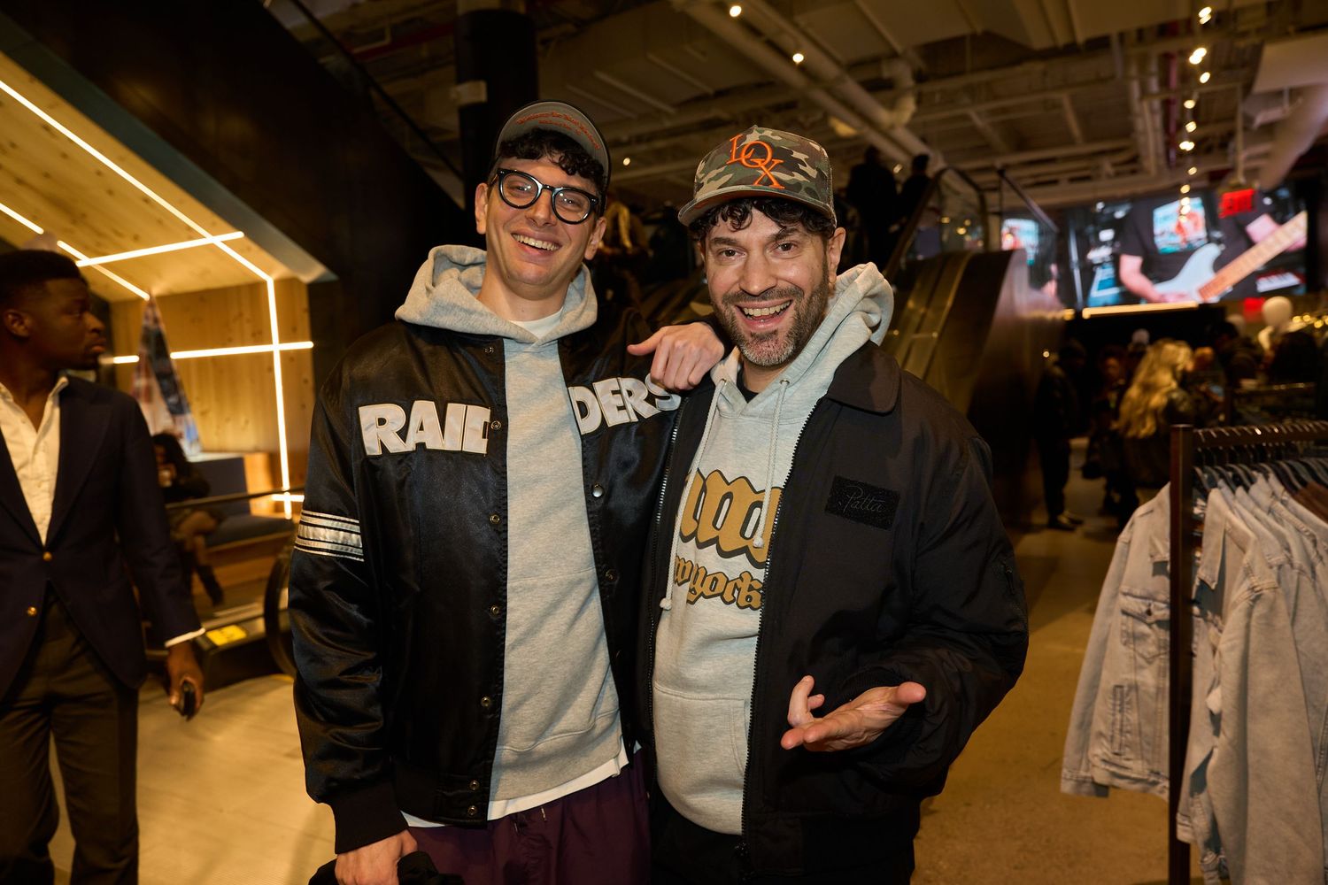 Fans mingle and socialize at an indoor sports-themed gathering or event.