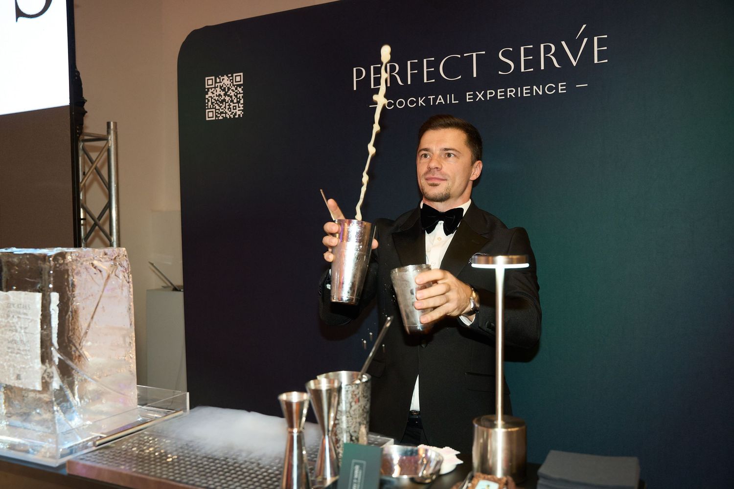 Elegant bar setup with Perfect Serve branding and professional bartending display.