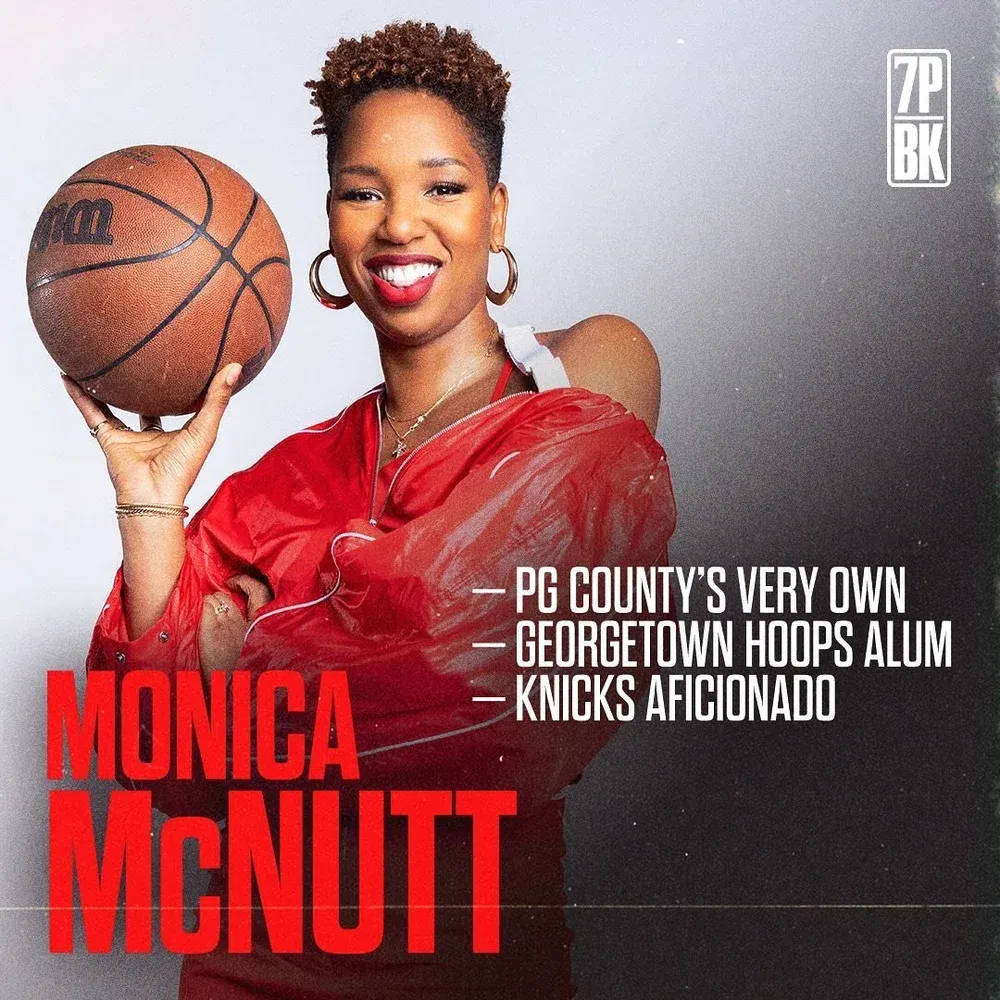 Basketball player in red jersey poses with basketball in series of promotional sports photos for PG County.