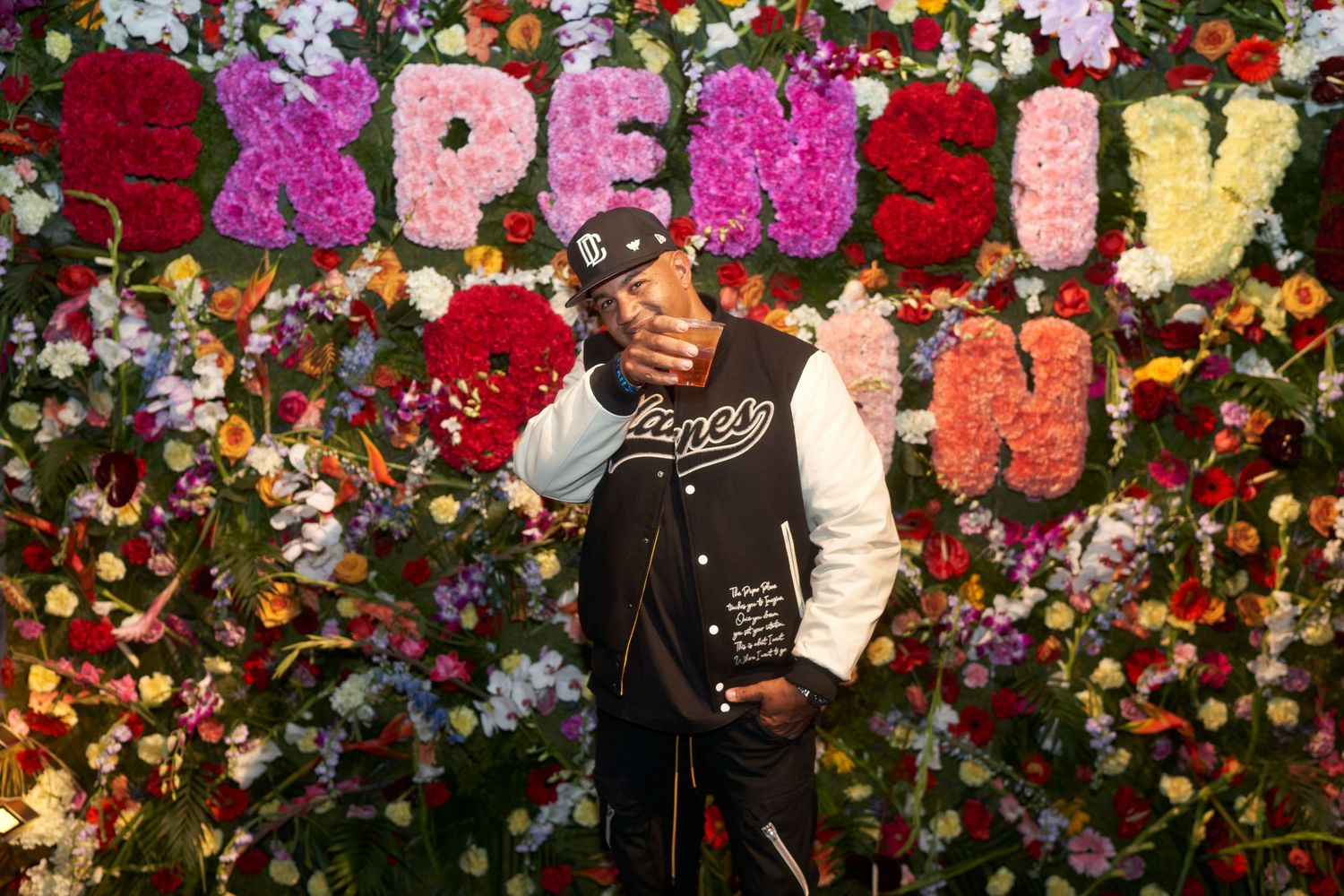 Several floral backdrops feature different event scenes with decor and clothing against vibrant flower walls.