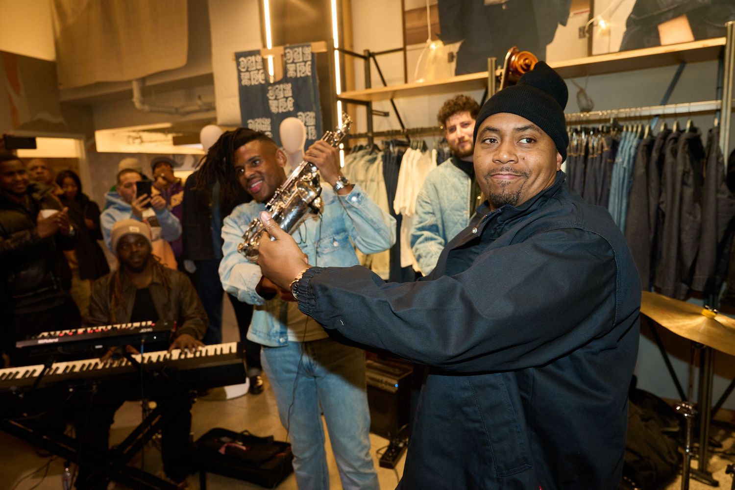 Jazz ensemble performing in a small venue with keyboard, bass, and other instruments.