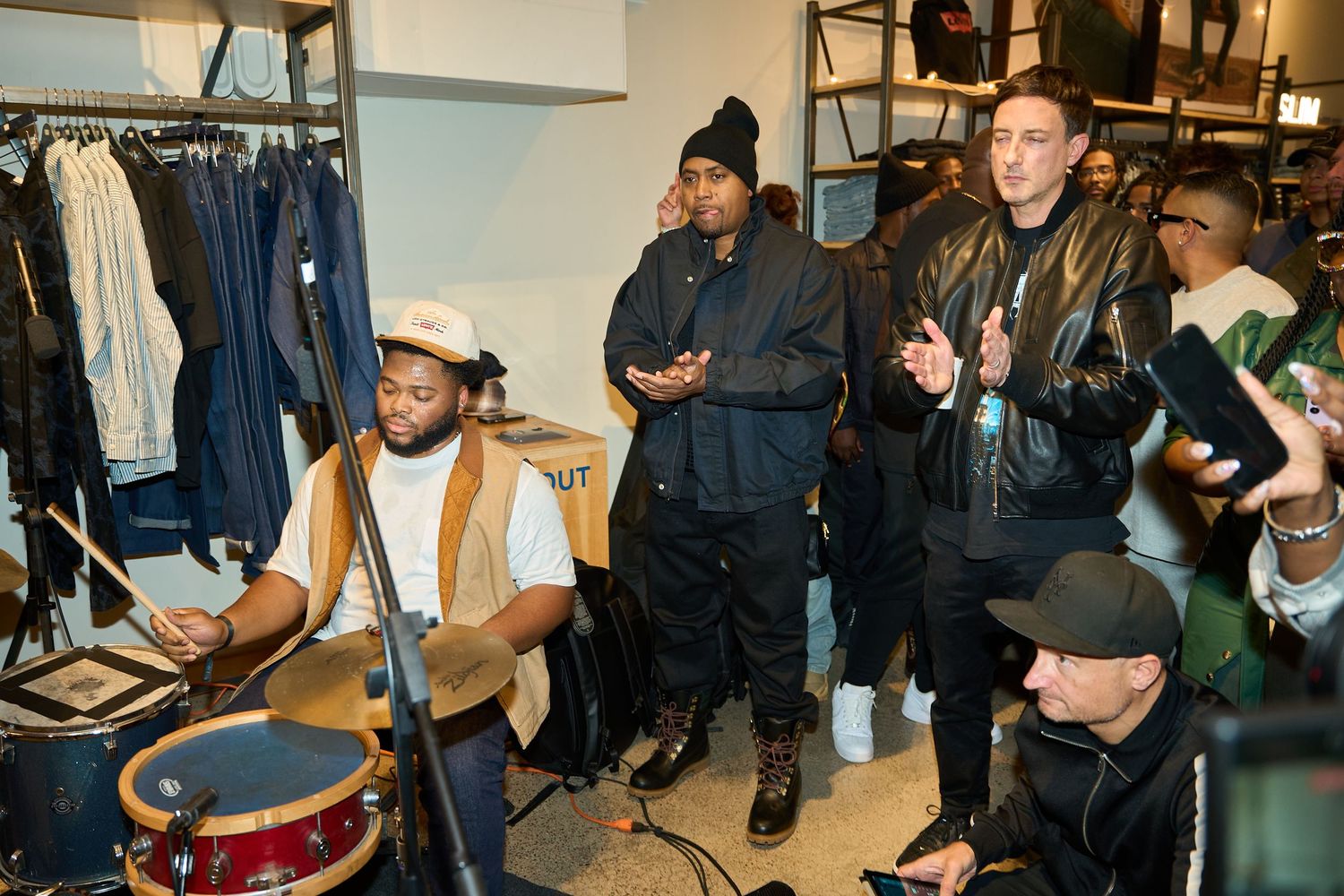 Musicians perform on drums and percussion instruments during a studio session.