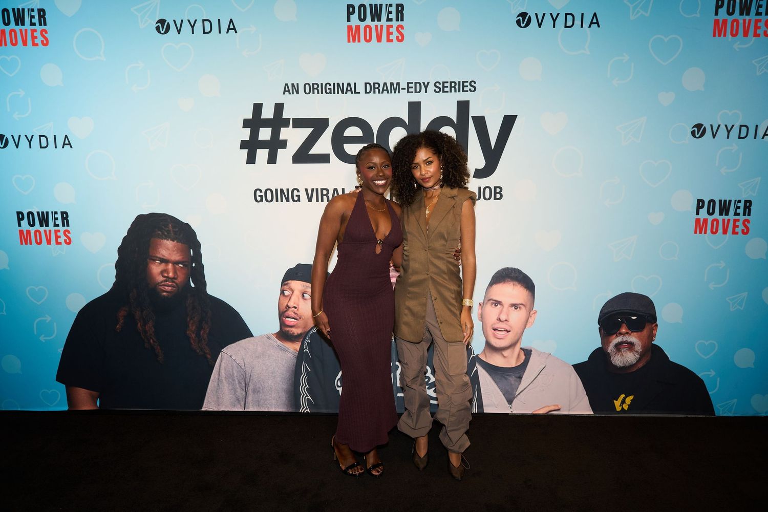 Two women pose at the #Zeddy original dram-edy series premiere event with Vydia and Power Moves branding backdrop.