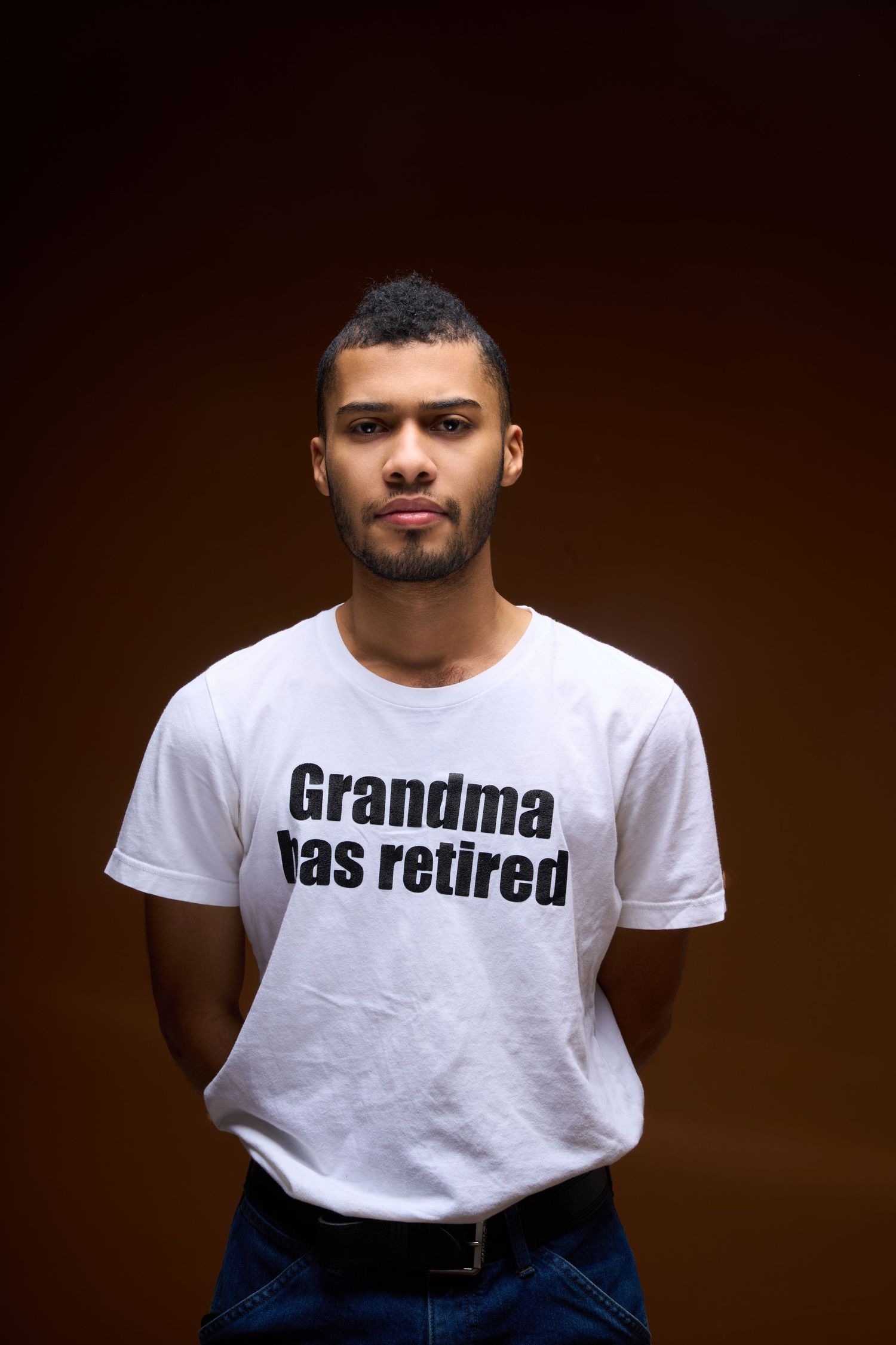 Series of photos showing white t-shirt with text 'Grandma has retired' against dark background.