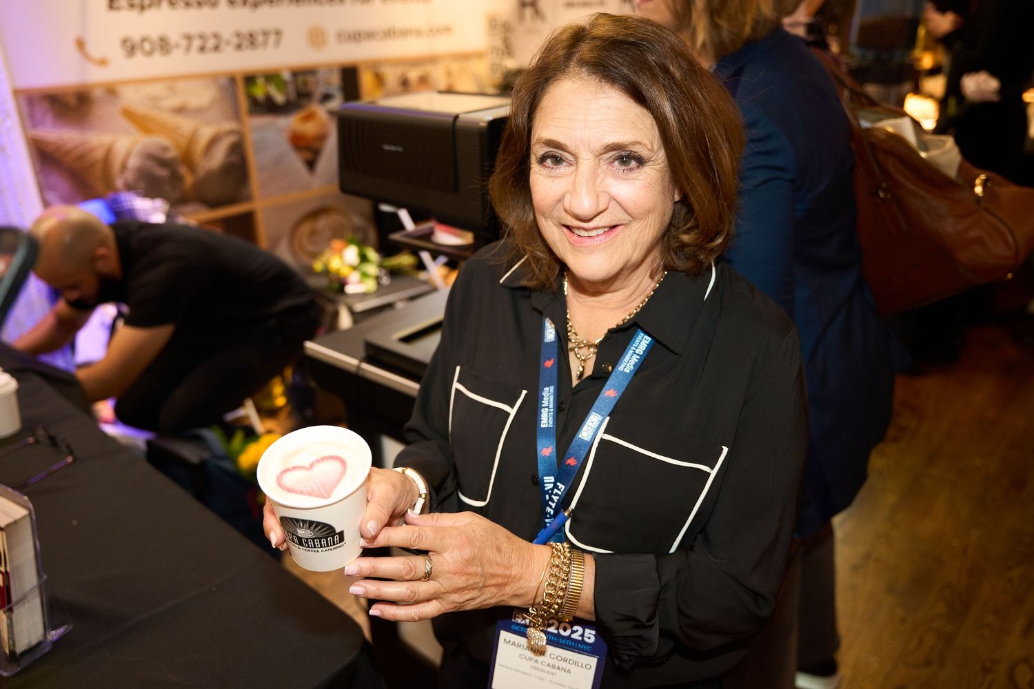Business professionals networking and mingling at a corporate event with drinks and conversation.