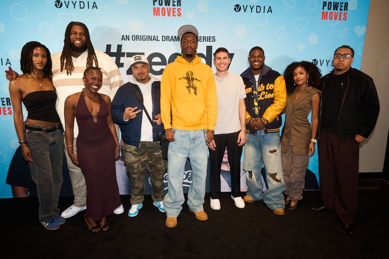 Cast members pose together at the Power Moves original drama series premiere event with Vydia branding.