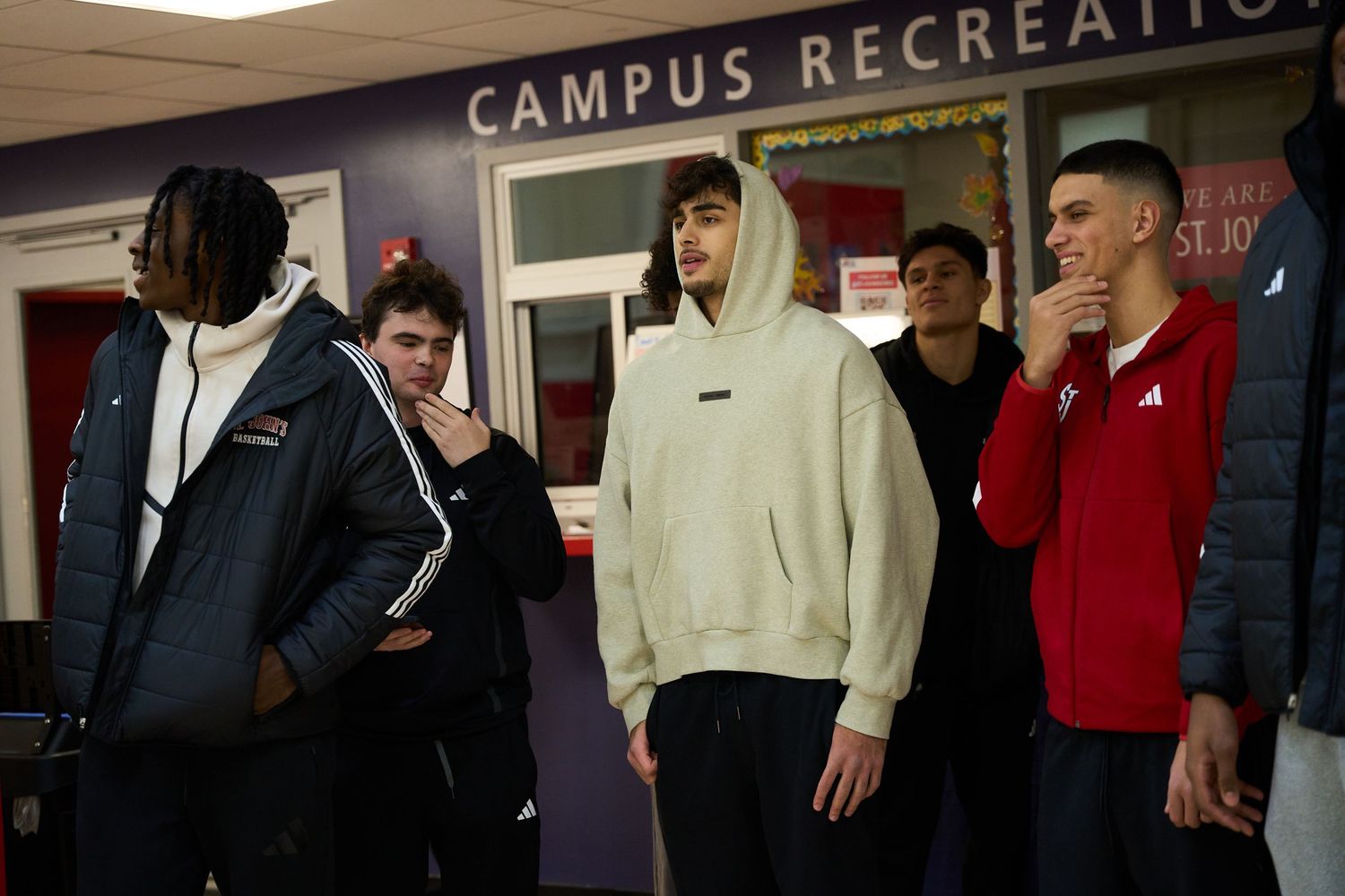 Students gather in a campus recreation facility wearing casual athletic attire.