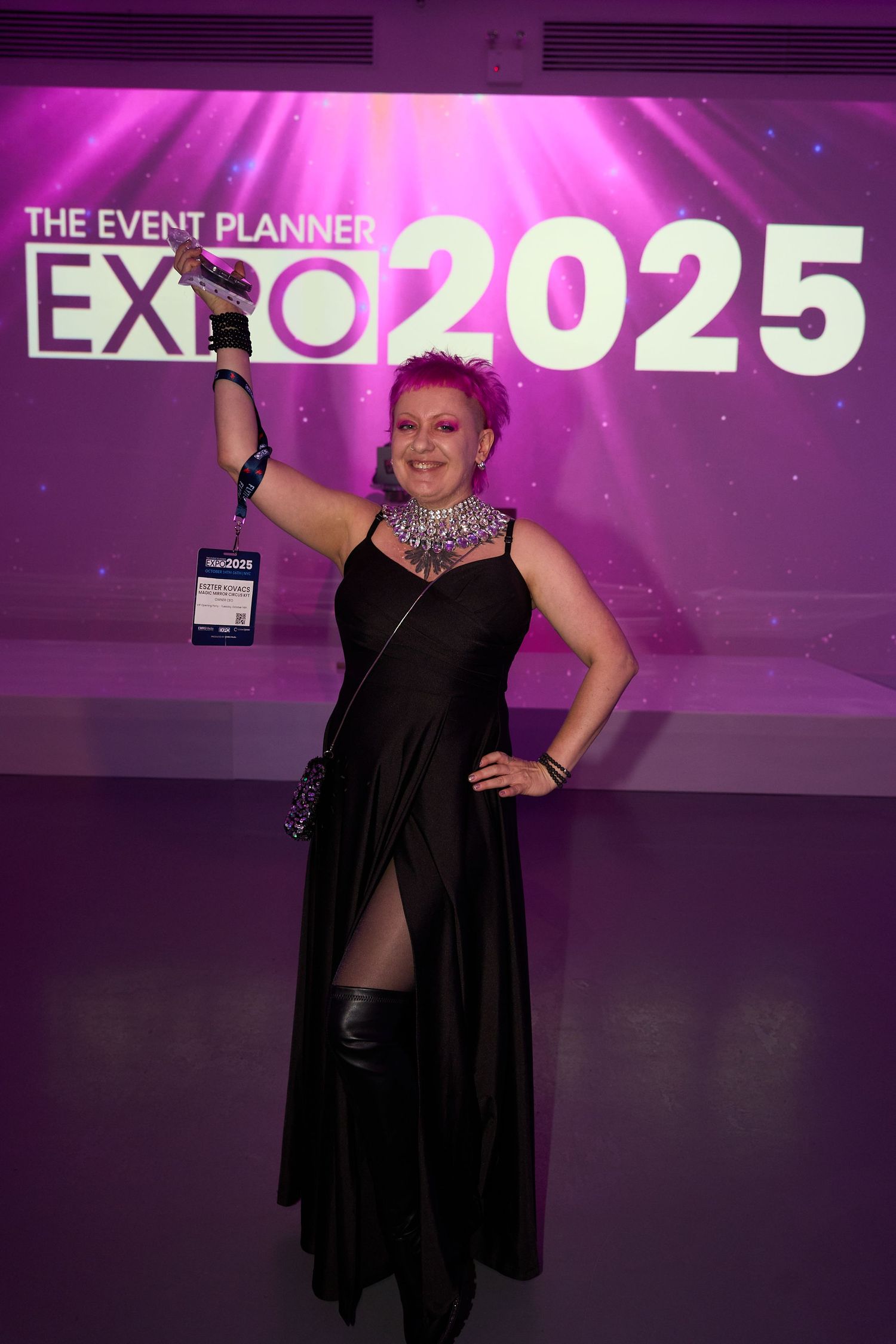 An event planner expo display with purple lighting and signage reading 'EXPO 2025' in the background.