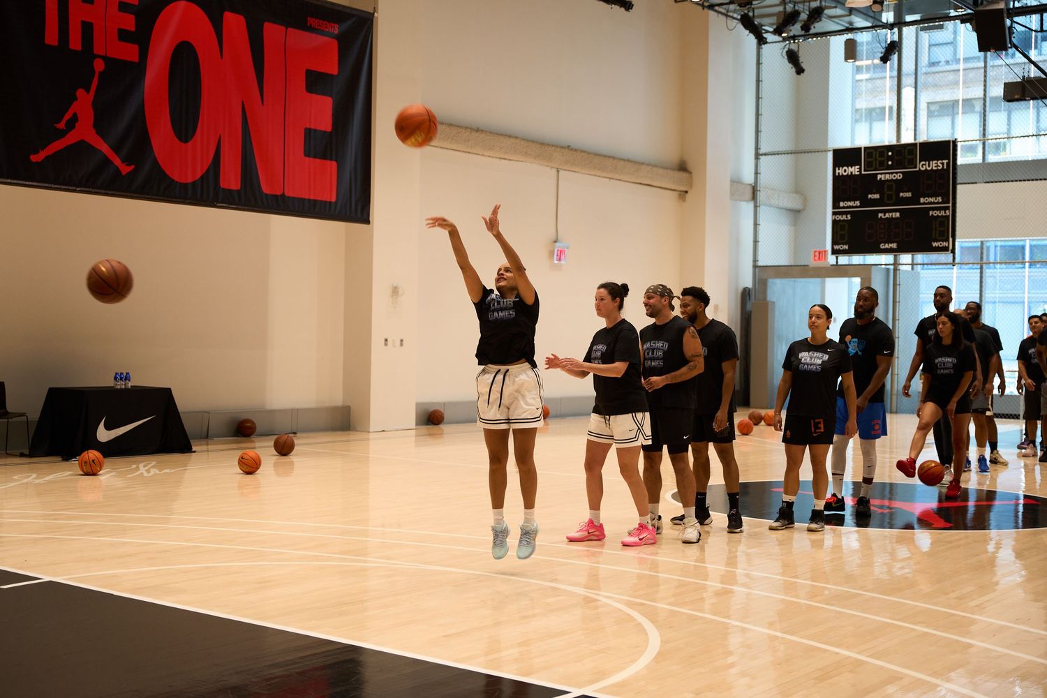 Basketball players practice in a gym with red wall signage visible through multiple connected interior photos.