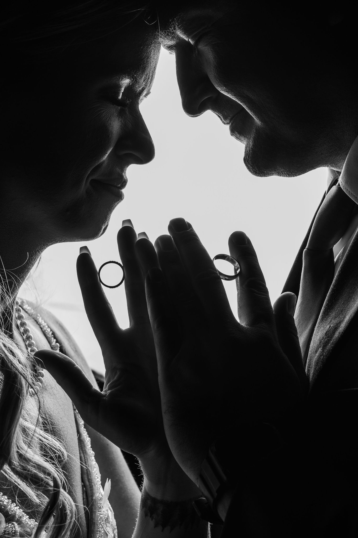 Black and white silhouettes show intimate romantic moments between couples in a dramatic artistic series.