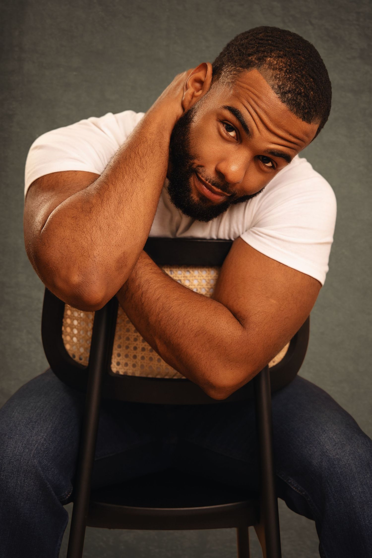 A series of emotional portrait photographs showing someone seated in a chair against a dark background.