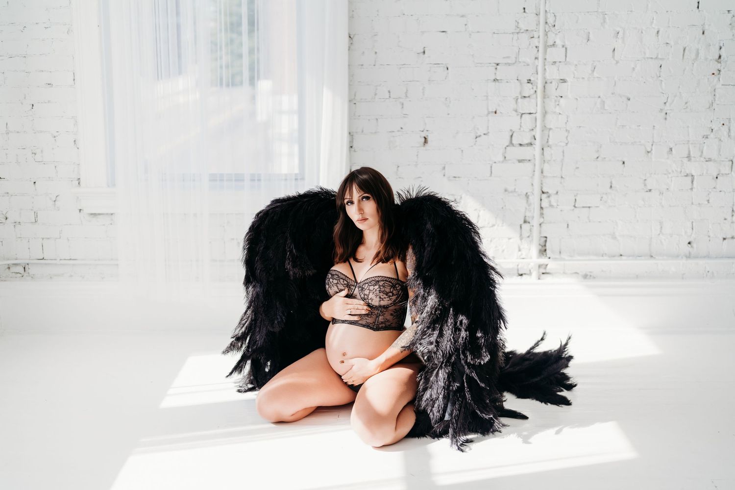 A collection of sensual boudoir photos showing a reclining figure with flowing dark hair against a bright white background.