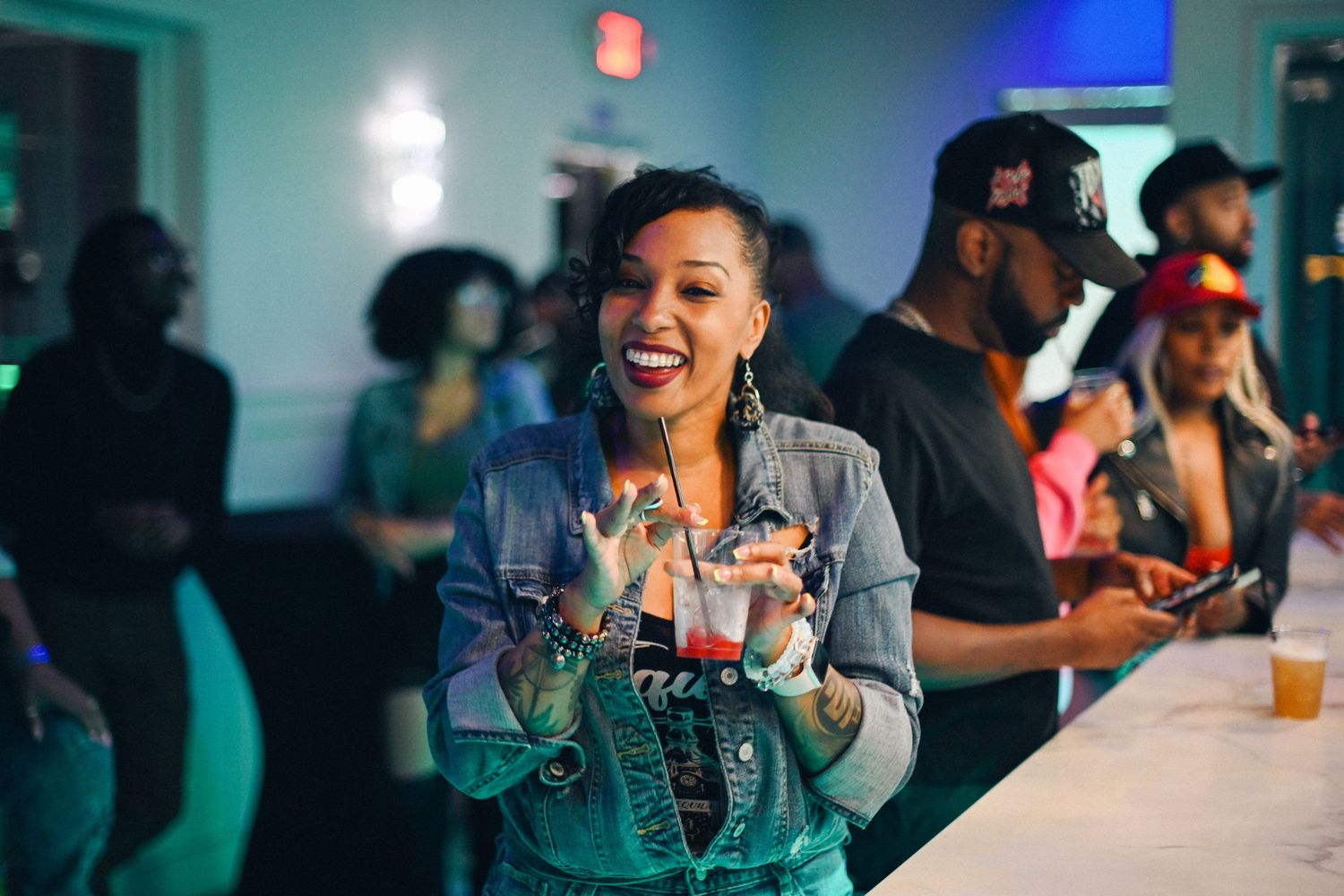 A festive scene at a party with roller skates with colorful lighting and people enjoying themselves.