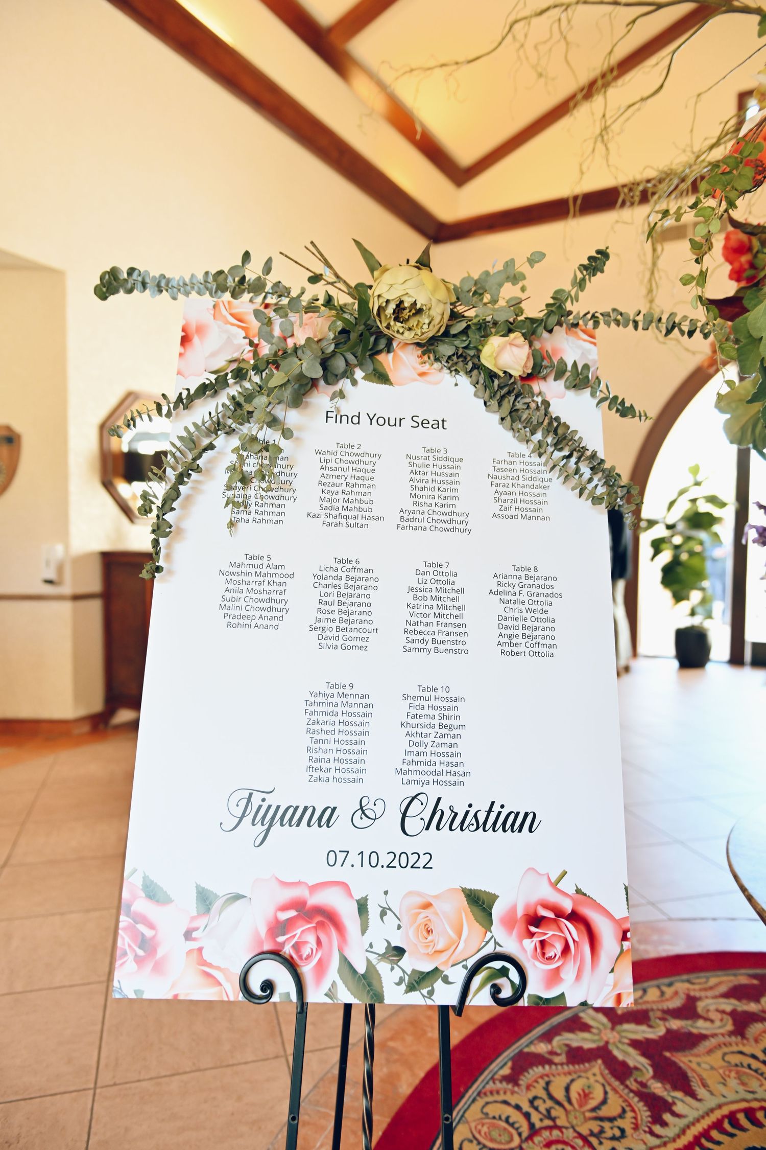 Wedding seating chart decorated with eucalyptus and roses for Tijuana & Christian's celebration.