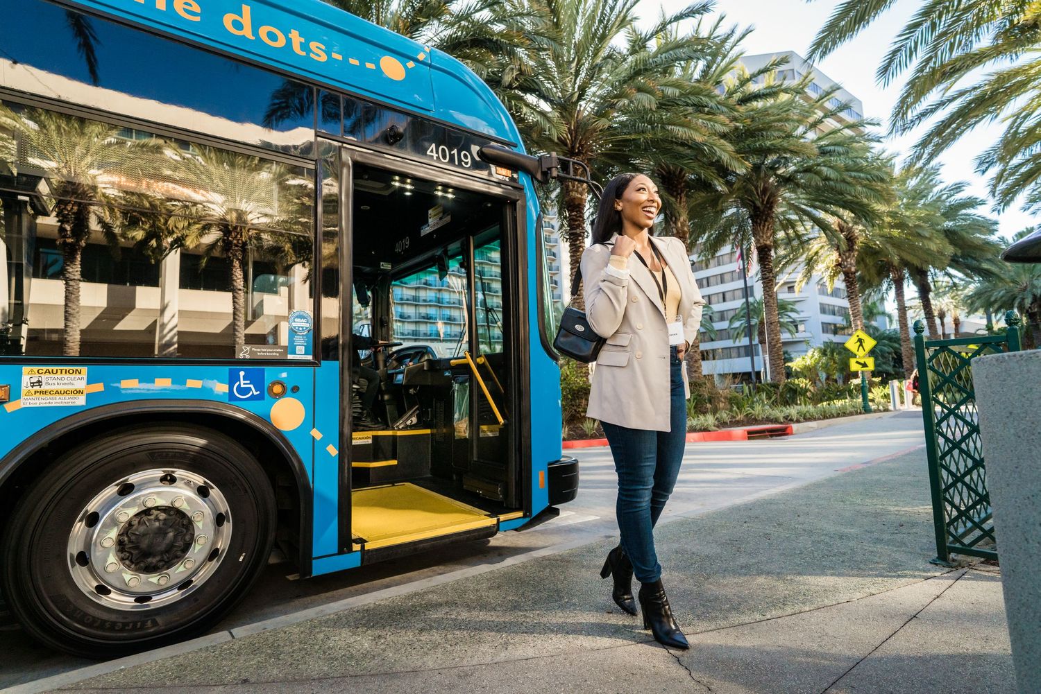 a business professional arriving at the Anaheim convention center on Anaheim resort transportation bus