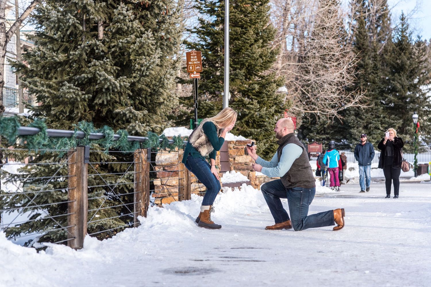 Winter marriage proposal in downtown Breckenridge Colorado captured by a hidden photographer