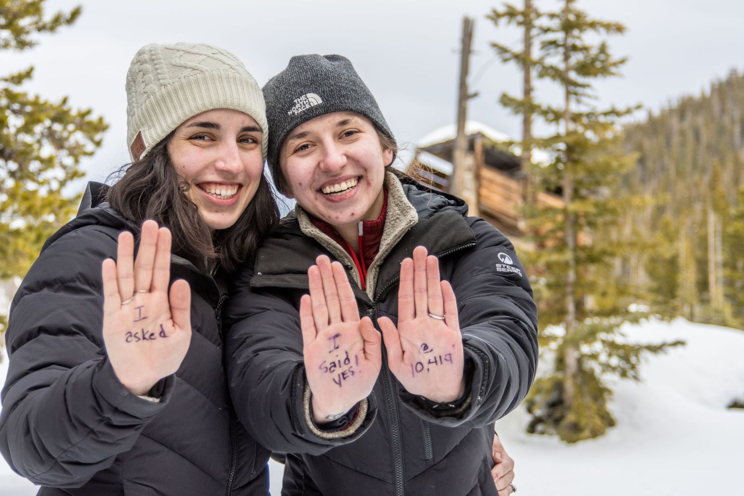 Showing off their hands after this same sex marriage proposal in Breckenridge, CO along the Sally Barber trail.