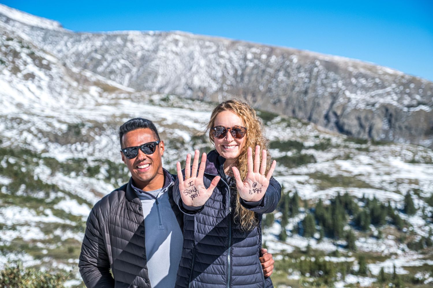 Late spring surprise marriage proposal showing off I said yes hands. (Breckenridge, C).