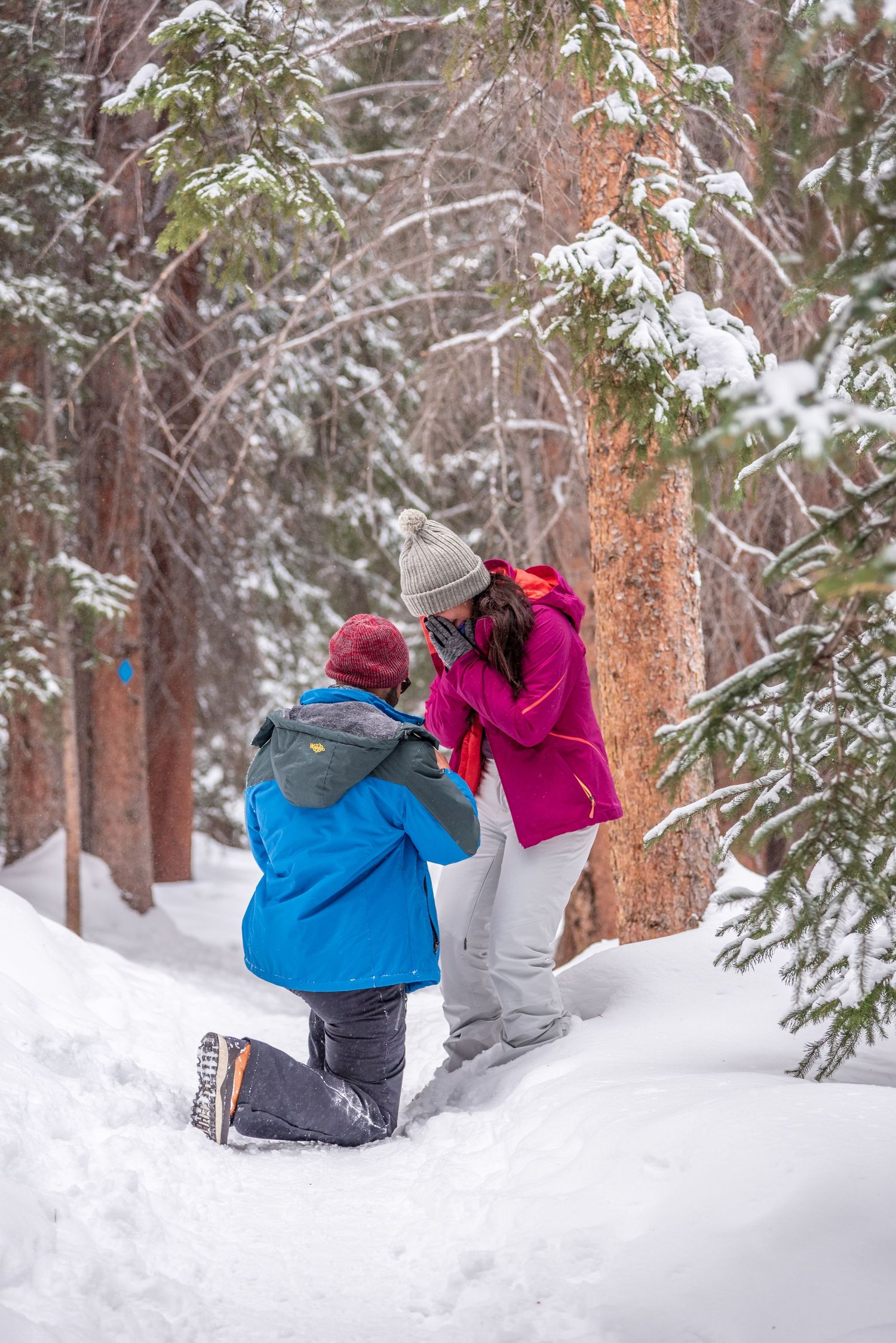 Marriage proposal in Breckenridge Colorado captured by a hidden photographer (winter)