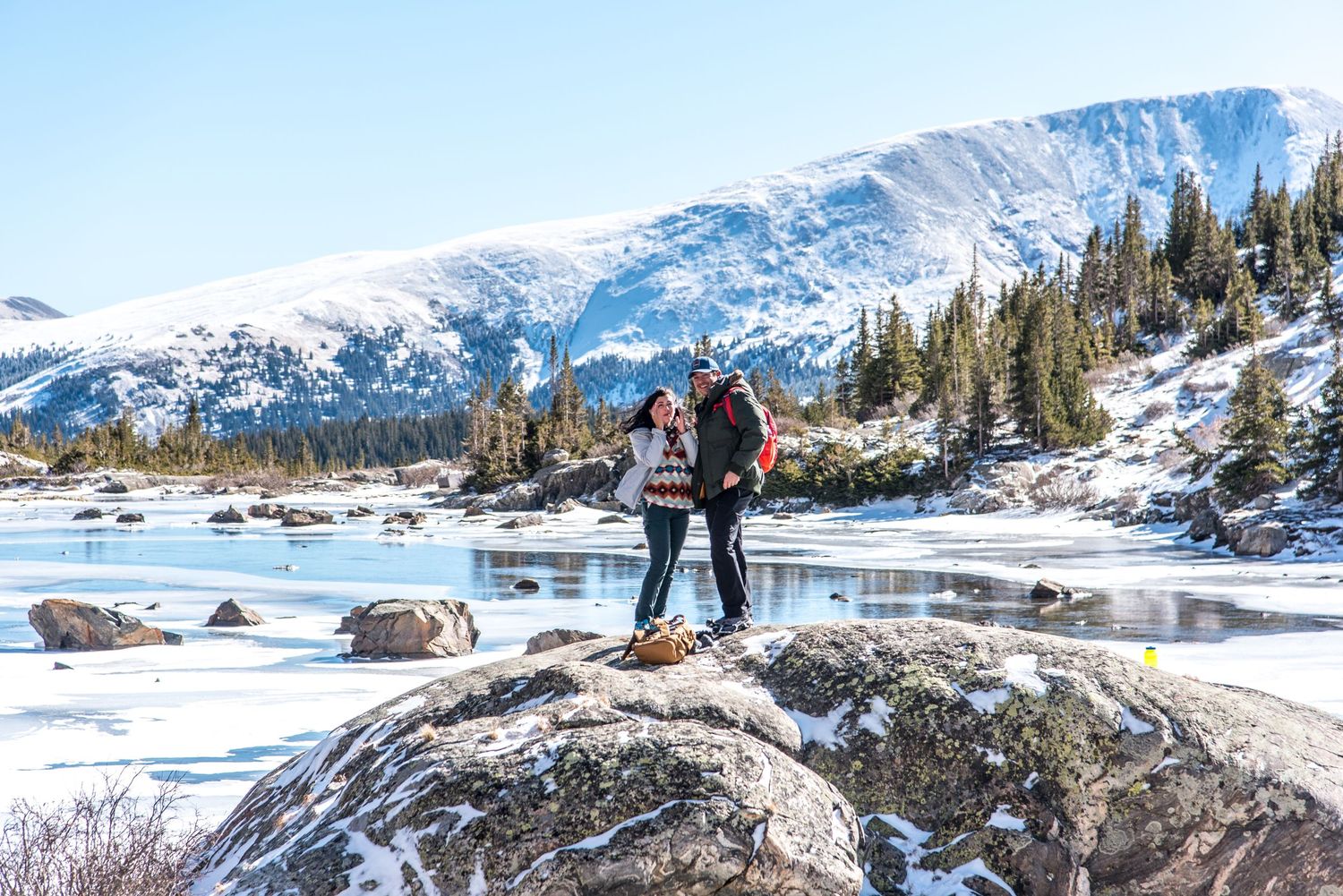 Couple laughing after their surprise marriage proposal near Breckenridge, CO (Mohawk Lakes)