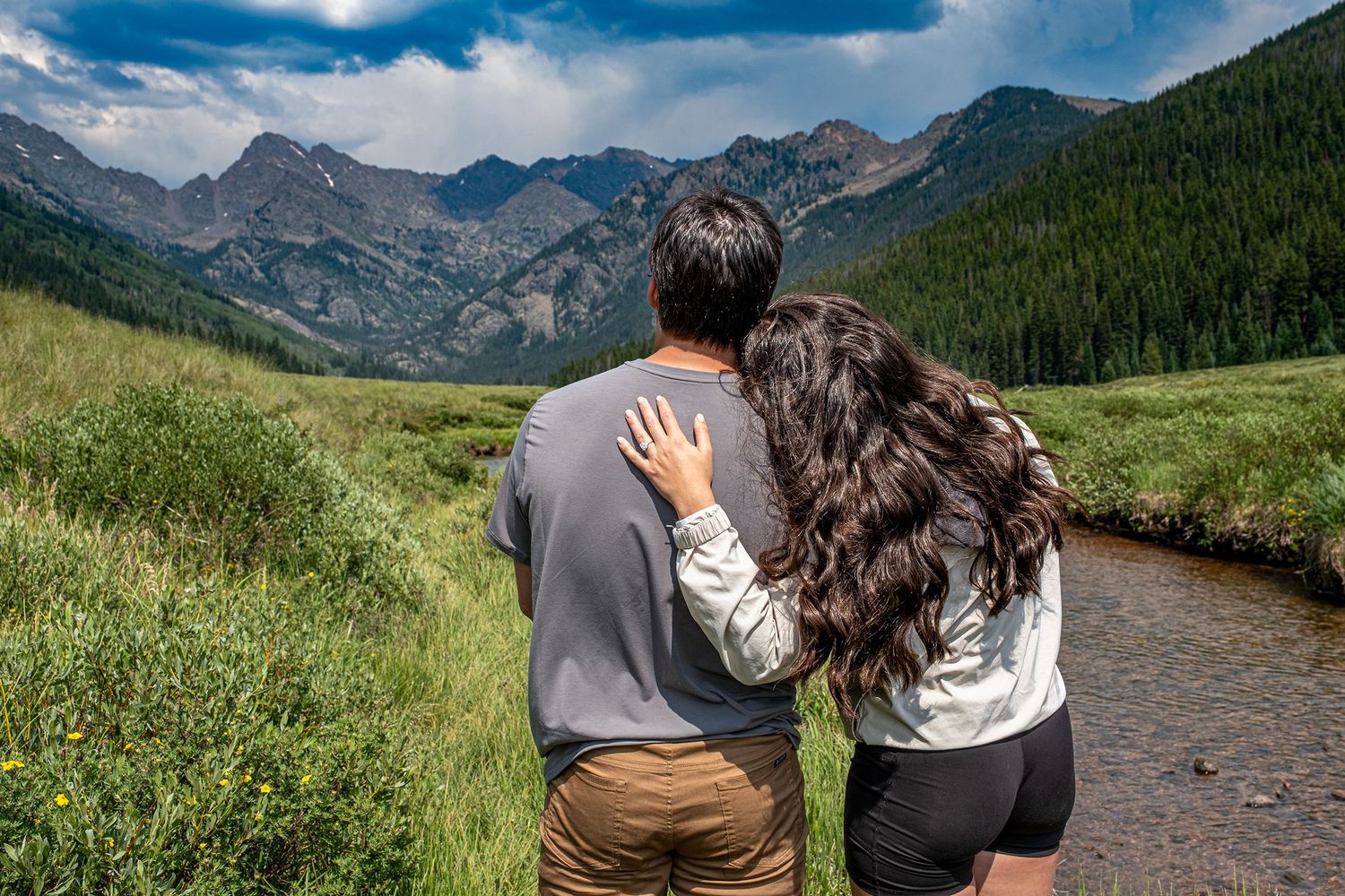A couple near Vail, CO just moments after a hidden photographer captured their surprise proposal.