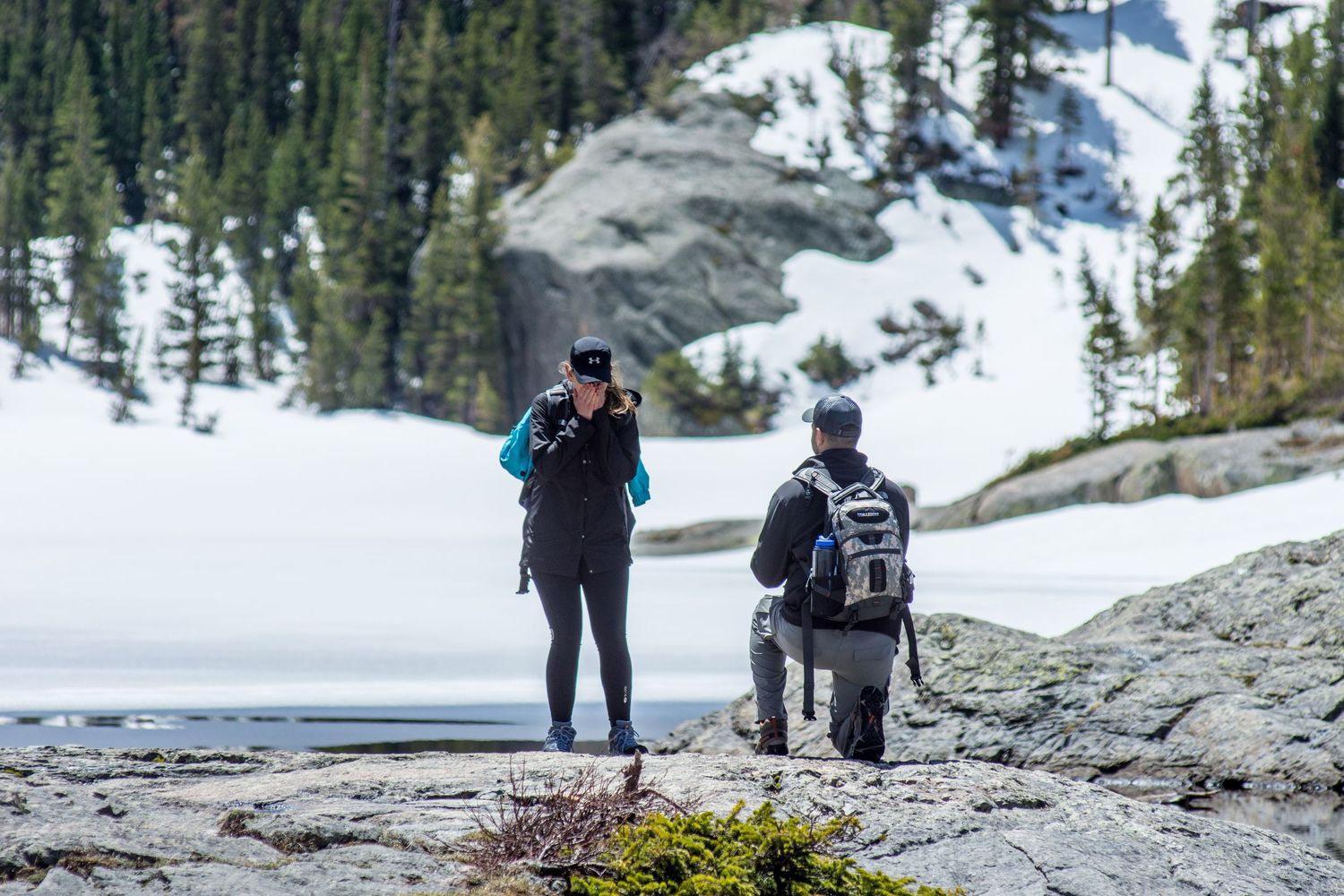 Down on one knee - marriage proposal photograph in Rocky Mountain National Park (Dream Lake - late spring)