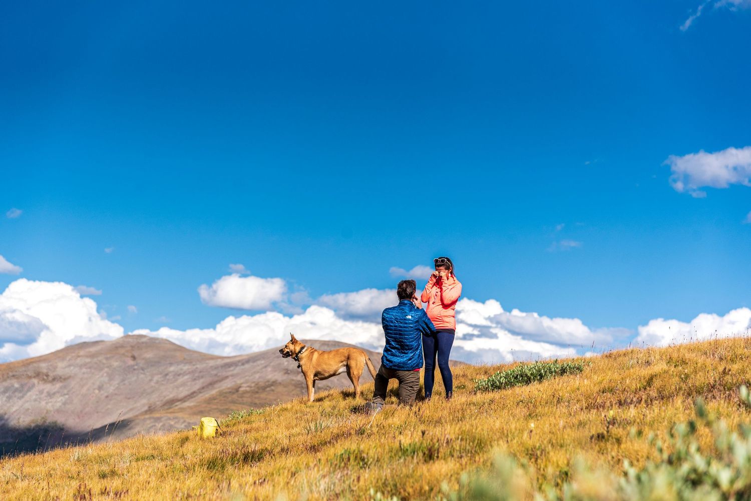 Hidden photographer captures marriage proposal on top of mountain near Breckenridge, CO