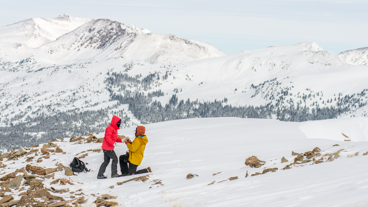 Snowmobile adventure turns into marriage proposal captured by a hidden photographer near Vail, CO