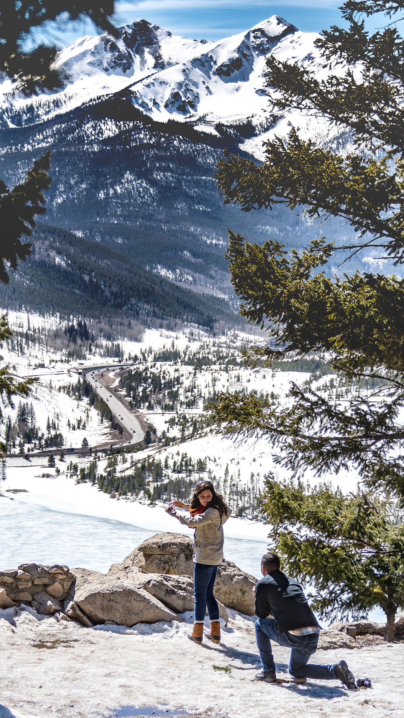 Hidden photographer captures a man down on knee to surprise his girlfriend with a marriage proposal at Sapphire Point Overlook (Colorado)
