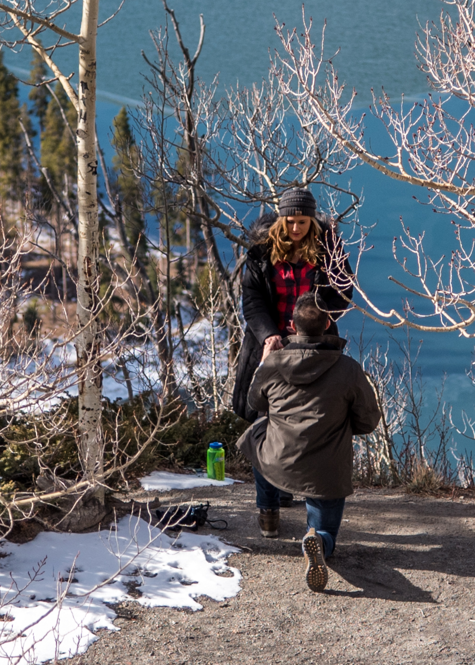 First of three images showing the surprise reaction to a marriage proposal photographed in Breckenridge, CO.