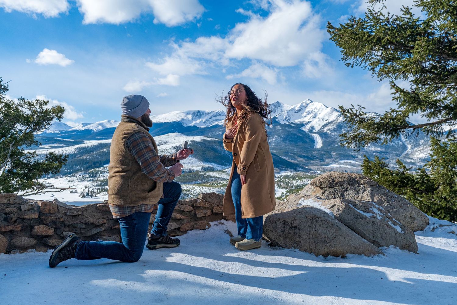 Winter marriage proposal photographed at Sapphire Point Overlook by hidden photographer.
