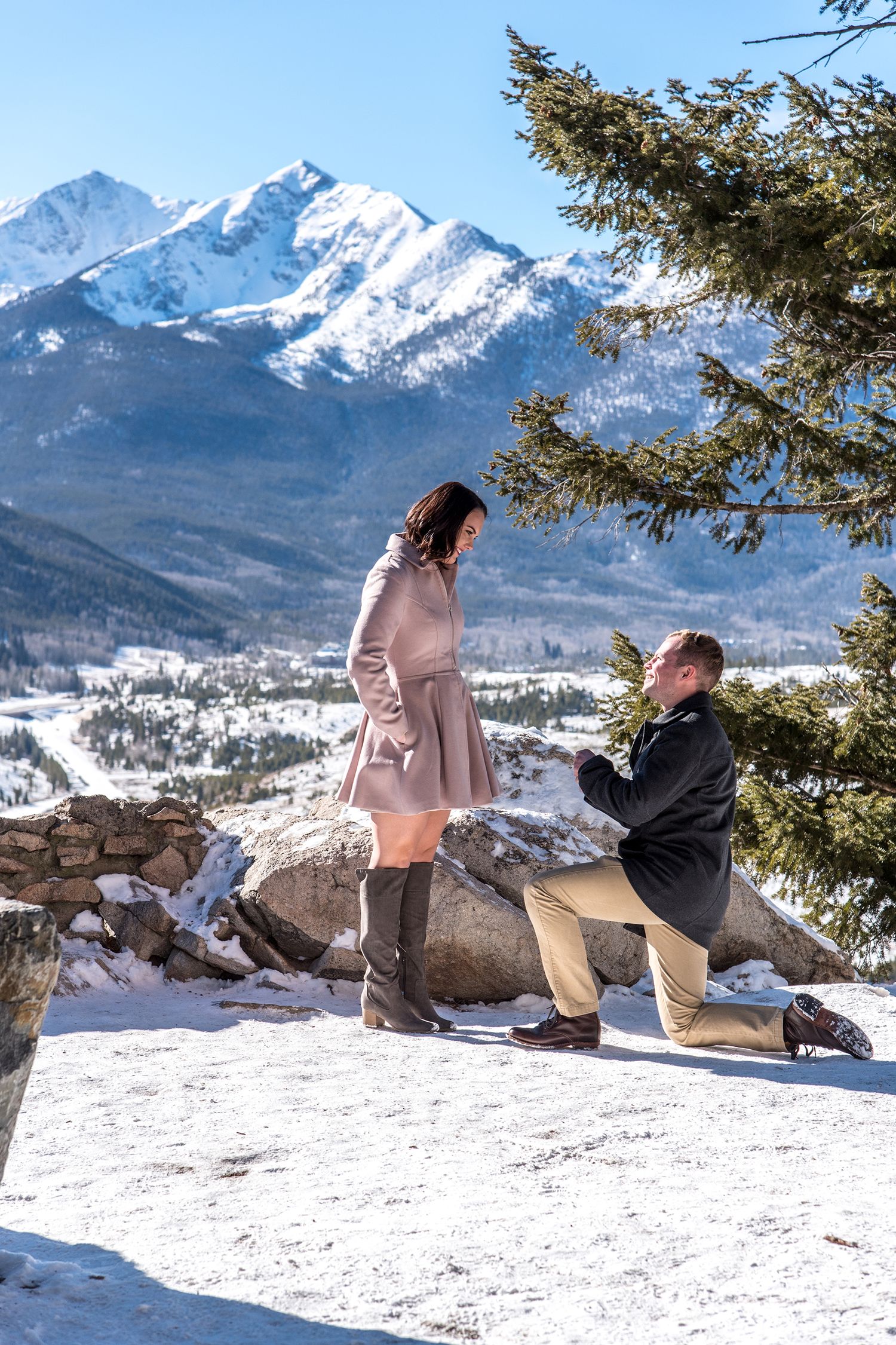 Winter marriage proposal photographed by a professional photographer at Sapphire Point Overlook near Breckenridge, CO