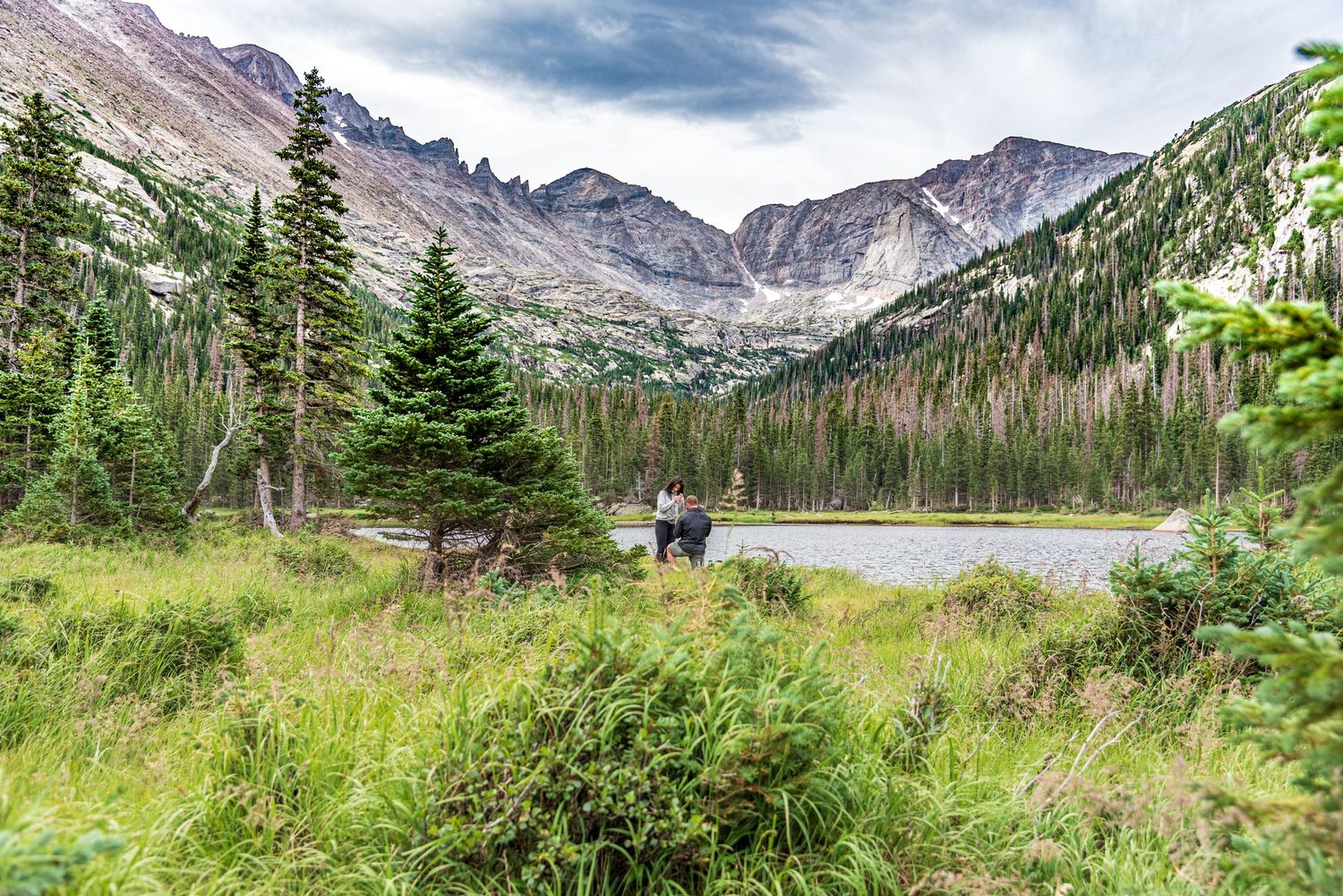Mills Lake in Rocky Mountain National Park surprise marriage proposal photographed by a hidden photographer. (Colorado)