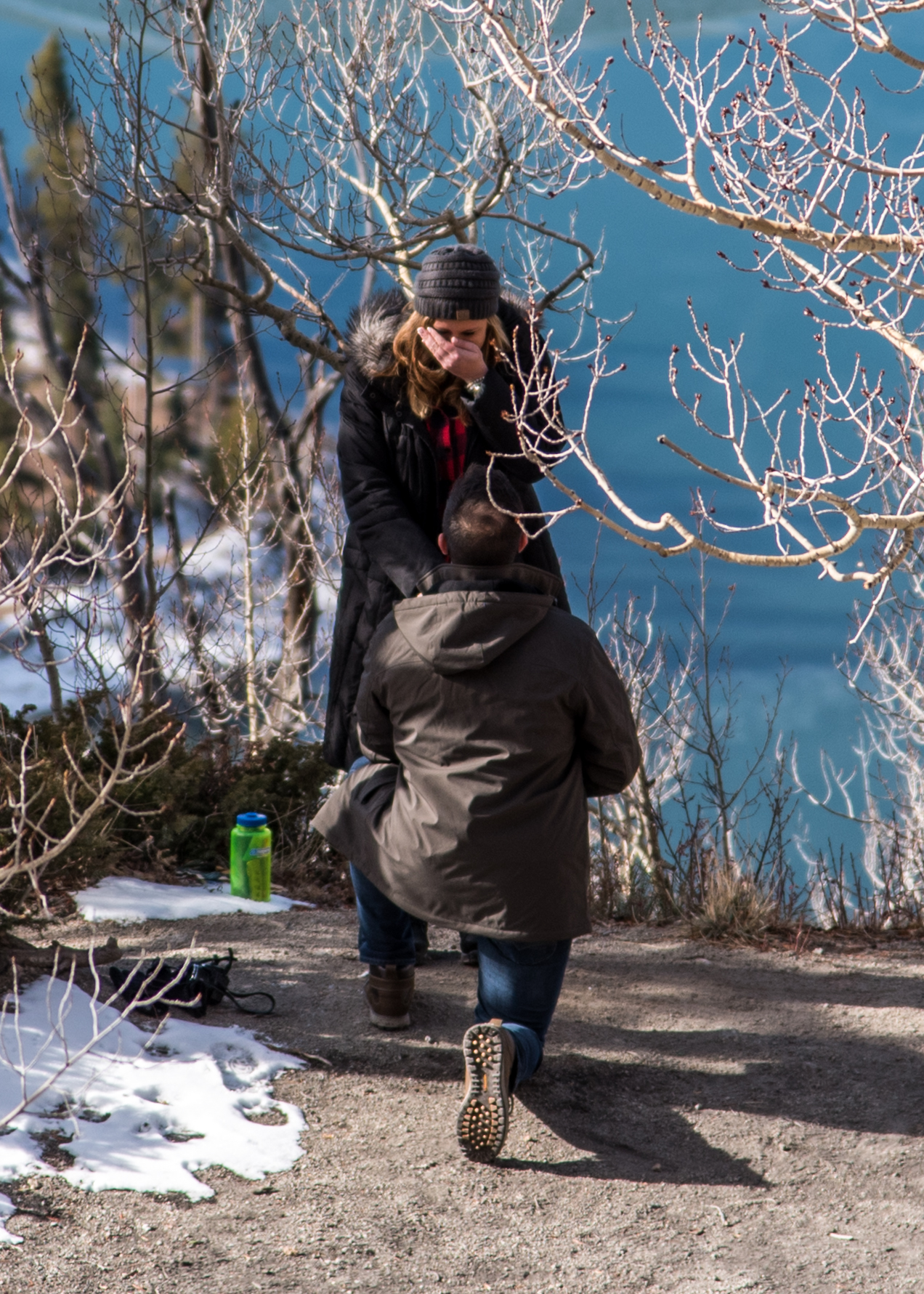 Second of three images showing the surprise reaction to a marriage proposal photographed in Breckenridge, CO.