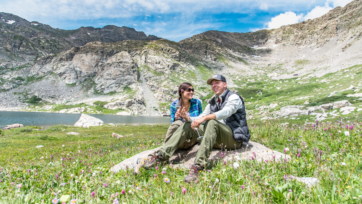 Newly engaged couple enjoying the moment after their surprise marriage proposal near Breckenridge, CO