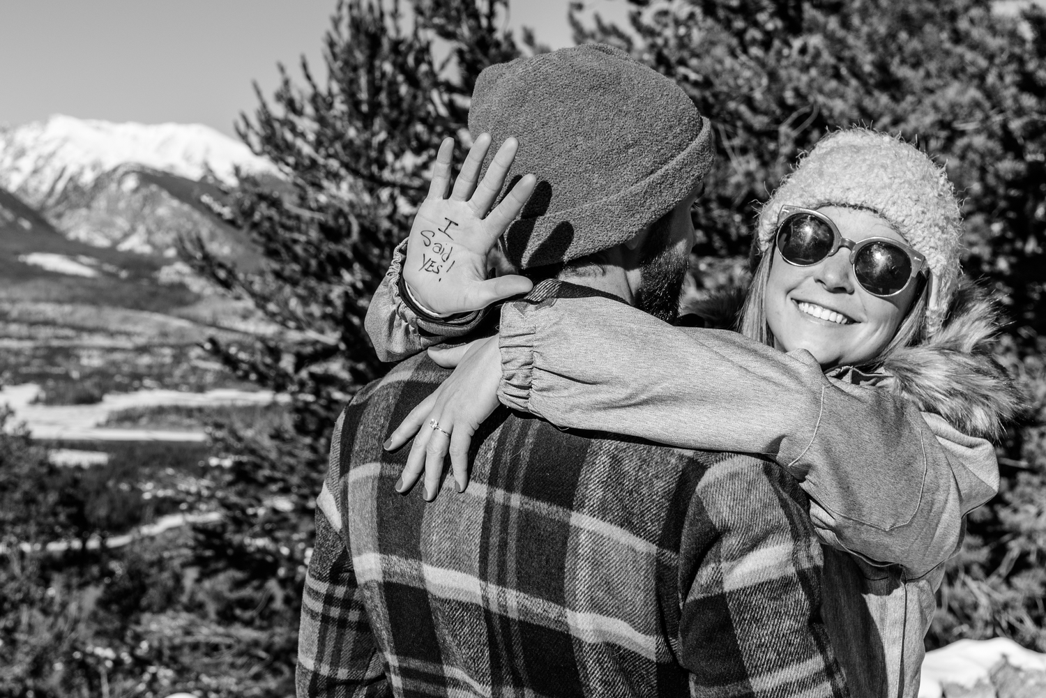 Smiling faces after she said yes to his marriage proposal at Sapphire Point Overlook near Breckenridge, CO captured by a hidden photographer