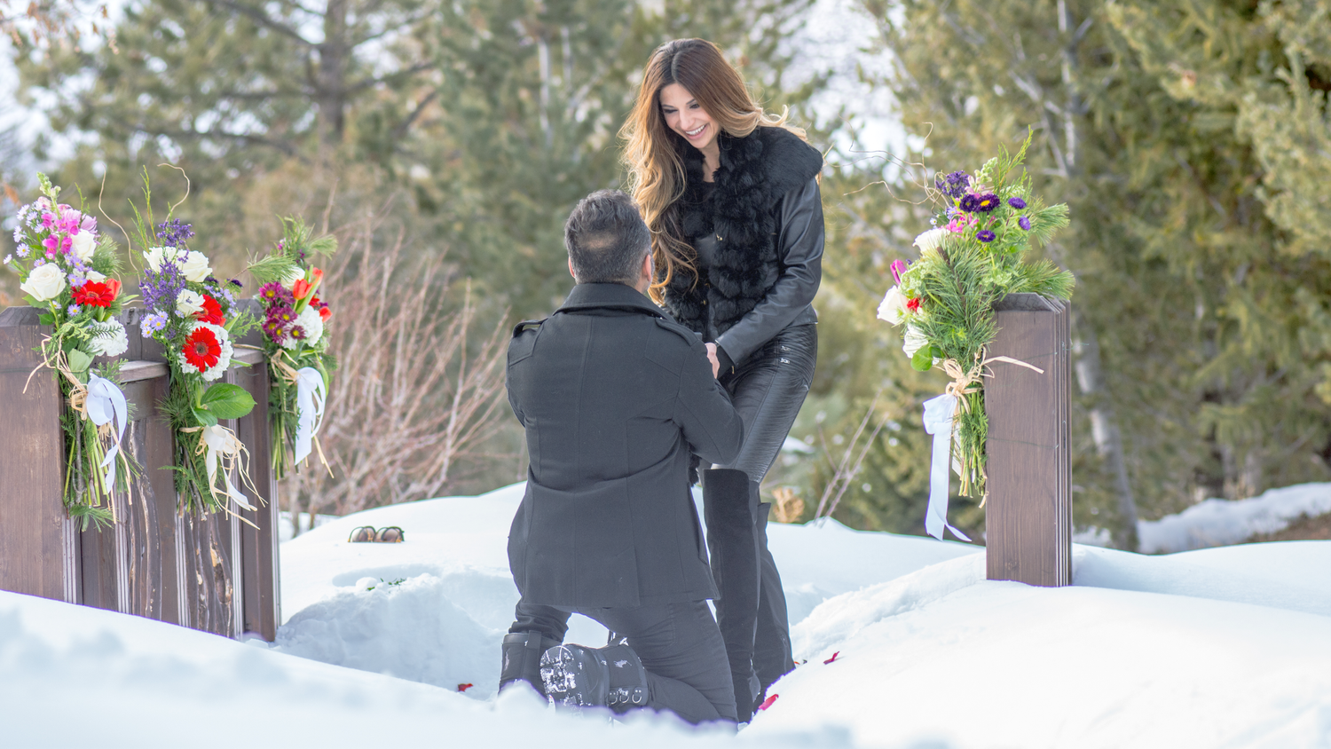 Snowy bridge marriage proposal in Vail, CO