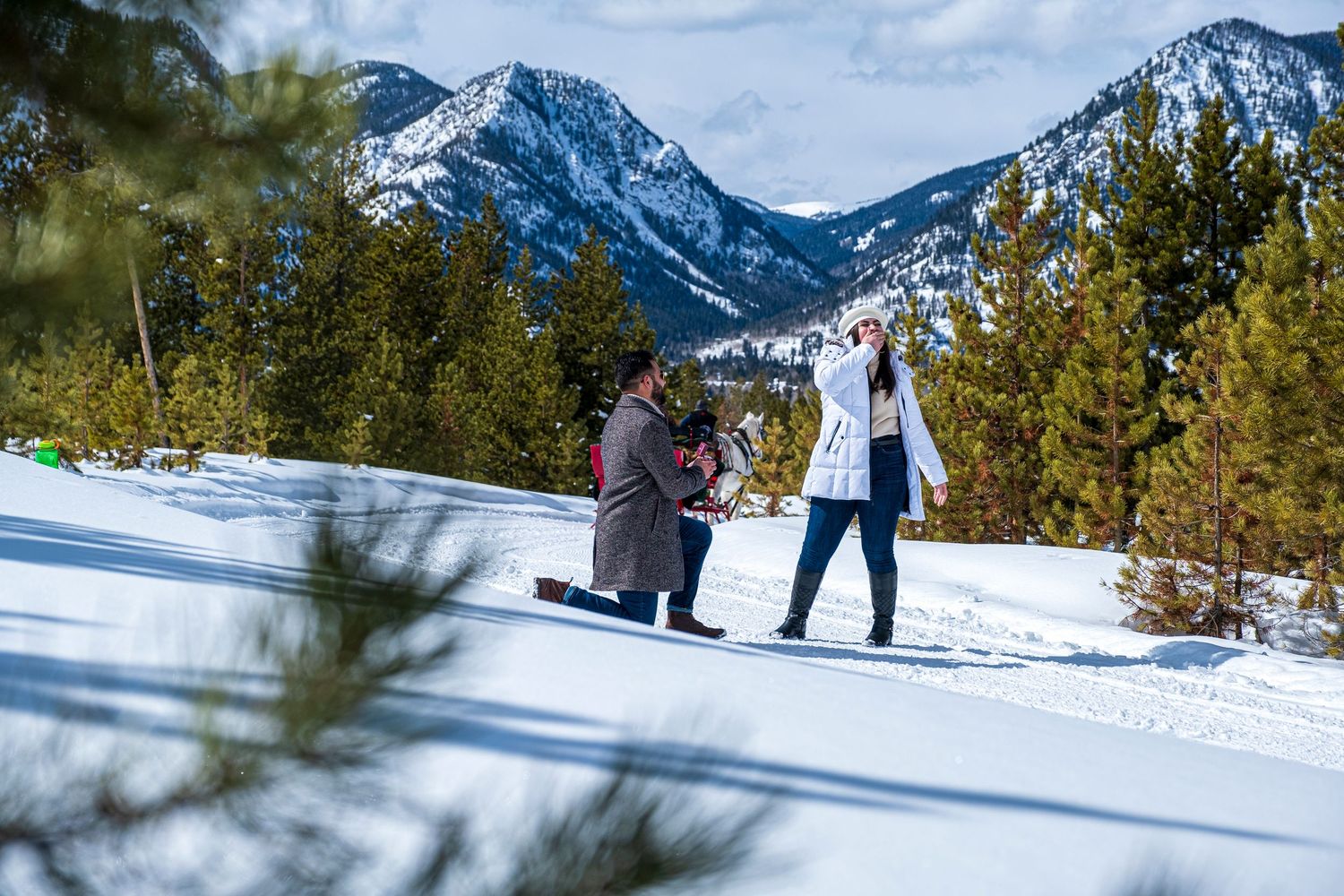 Marriage proposal during a one horse open sleigh ride near Breckenridge Colorado captured by a hidden photographer (with Two Below Zero)